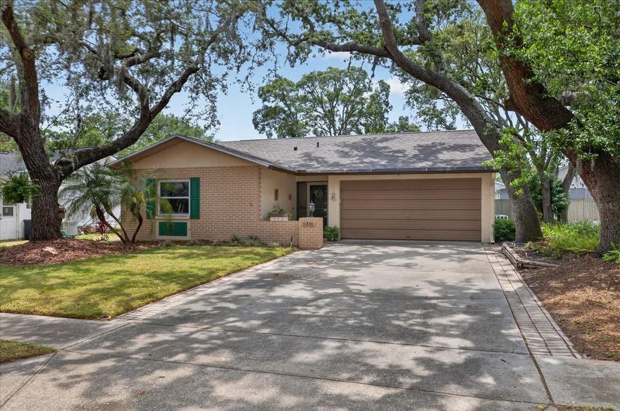 Welcome to this beautifully maintained, fully furnished home tucked away in a private enclave in 'X' flood zone, high and dry, just off Trouble Creek Road in New Port Richey. This move-in ready residence has been exceptionally cared for and offers both comfort and peace of mind with all new hurricane-impact windows and Rolladen storm shutters protecting the porch area. Inside, you’ll find a bright and open floor plan featuring a spacious kitchen with a convenient rolling island, perfect for entertaining or everyday living. Additional update includes a roof that is approximately 5 years old. Conveniently located near shopping, dining, medical facilities, and Gulf Coast amenities, this charming home is ideal for year-round living or a seasonal retreat.