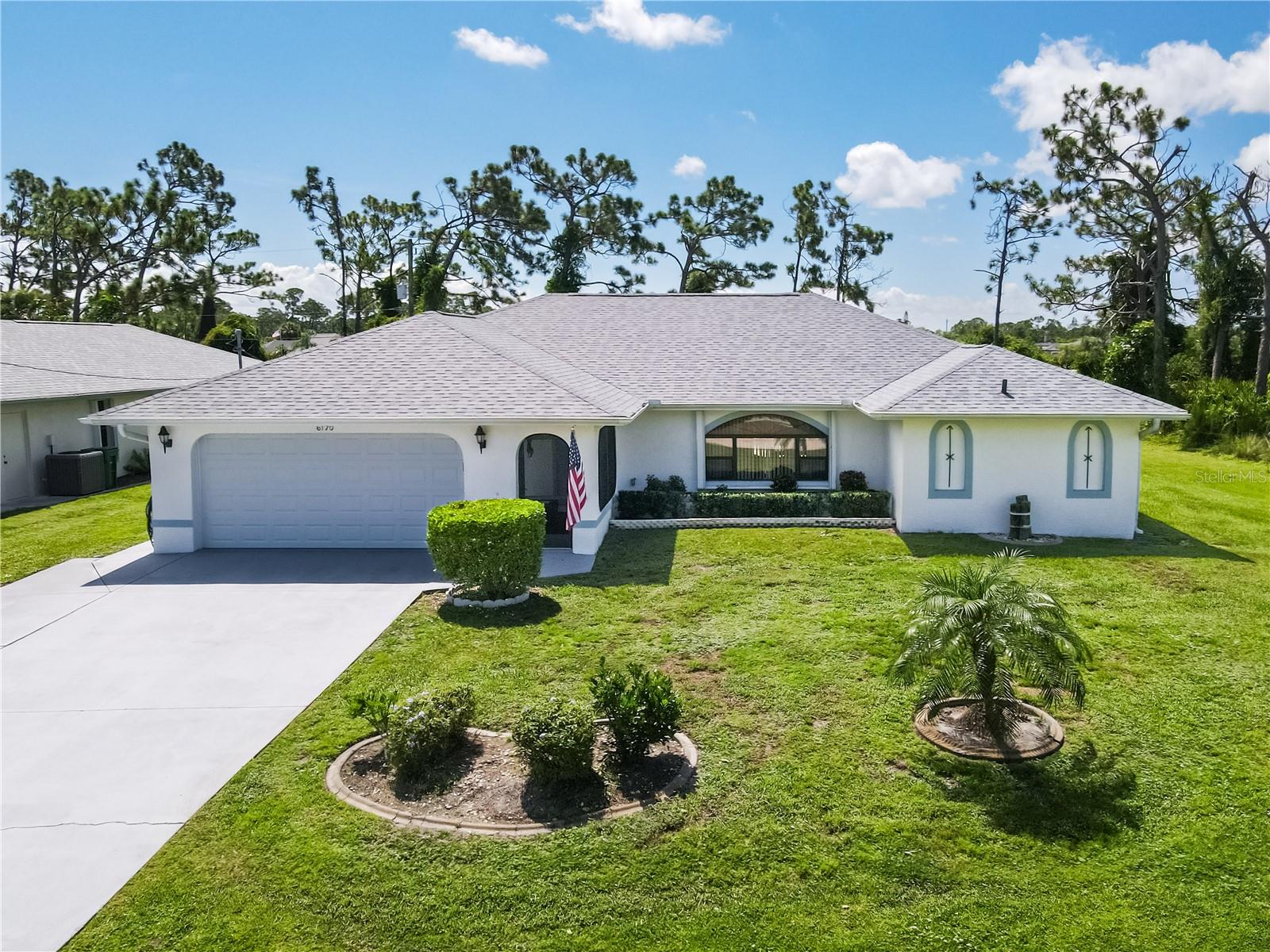 Welcome to this beautiful 3 Bedroom, 2 Bathroom, 2-Car Garage Pool Home with a family room, situated on THREE LOTS in the desirable Gulf Cove community. With plenty of space inside and out, this property offers the perfect blend of comfort, privacy, and Florida living. CLICK ON THE VIRTUAL TOUR LINK 1 FOR THE VIDEO AND VIRTUAL LINK 2 FOR THE 3D TOUR. Inside, you’ll find tile flooring throughout and a bright living room with a large window that flows seamlessly into the dining area—ideal for entertaining. The kitchen boasts stainless steel appliances, granite countertops, a breakfast bar, and a cozy dining nook. Just off the kitchen, the family room with a built-in desk provides additional living and gathering space. The spacious master suite features sliding glass doors to the lanai, dual walk-in closets, and a private bath with a walk-in shower, jacuzzi tub, single sink vanity, and linen closet. The split floor plan places the guest bedrooms on the opposite side of the home, each with walk-in closets and a shared bathroom that also offers lanai access. Step outside to your own private retreat—an expansive screened lanai with a heated pool, large pool deck for sunbathing, and even a 10x8 A/C workshop room for hobbies or storage. The backyard provides ample privacy, with wooded vacant lots to the rear and side, while still leaving plenty of room for growth. 2023 ROOF - 2024 EXTERIOR PAINTED - 2020 WATER HEATER - 2024 POOL PUMP - 2025 POOL MOTOR & HOUSING - 2022 POOL RESURFACED - 2025 NEW WIRING, OUTLETS AND LIGHT COVERS - 2025 CARBON MONOXIDE/FIRE ALARMS - GENERATOR HOOK UP W ELECTRICAL PANEL SWITCH - HURRICANE SHUTTER W LOCKS - 2025 SHOWER HEADS. Gulf Cove has a voluntary HOA providing the community with year-round events and fundraisers, a family-friendly private waterfront park and playground complete with a pavilion and picnic tables for members, and a private property owner-maintained boat ramp. Conveniently located close to local shopping & boutiques, fine & casual dining, LIVE entertainment, and AWARD-WINNING BEACHES!! Schedule your showing TODAY!