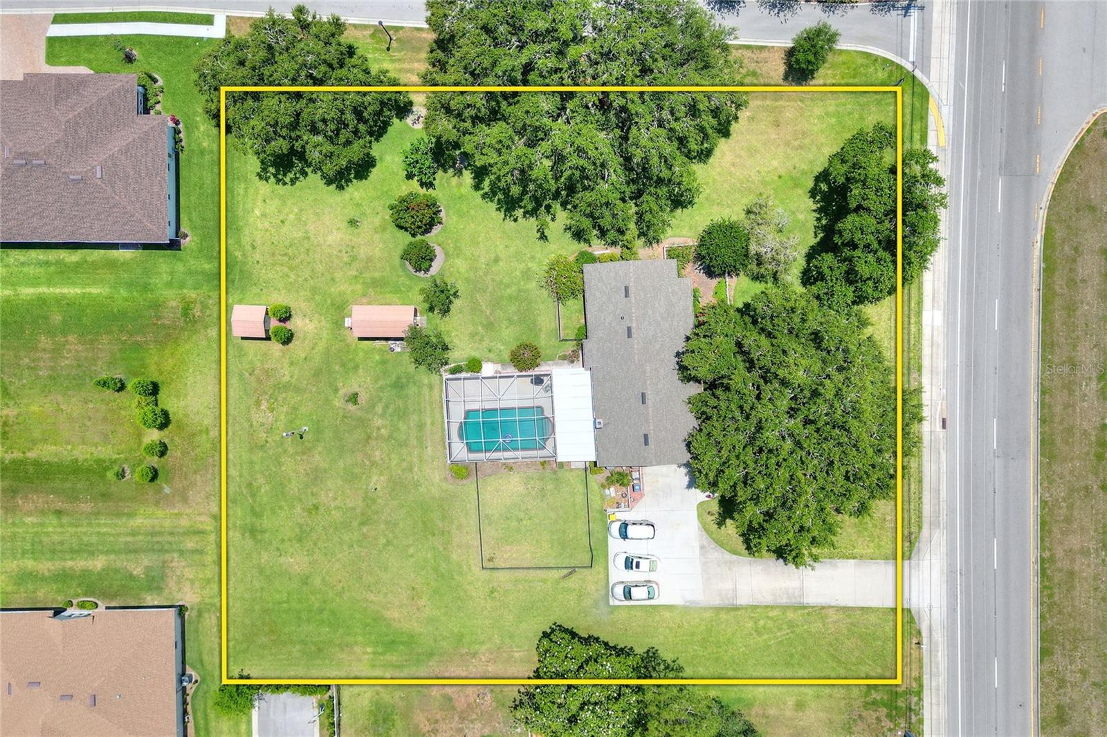 Looking for room to spread out - don't miss this property!! Set on a well landscaped acre lot this 4/3 (2495 la) split level pool home with separate 10x20 workshop/office offers so much! The house has 3 levels . On the main level is the L- shaped living/dining room with built-in bookcase/display cabinet, the remodeled kitchen/breakfast area with high end stainless KitchenAid appliances and entrance foyer. Up a few stairs is the bedroom area - 4 bedrooms and 2 baths. The lower level consists of the family room with fireplace and built-in bookcase wall, full pool bath, utility room and double car garage. Exiting the family room there is a large 15x30 covered patio area and oversized screened pool (pool is 16x30) - a great spot for relaxing or entertaining. Behind the house is the workshop/office (insulated) with electricity and connected to cable, wi-fi and phone. There is an additional building for garden equiptment and supplies. Water for household use and irrigation is supplied by a 310 foot deep well which results in a lower utility bill. A water softener is included. Double pane thermal windows and zoned HVAC systems helps to conserve energy as well as the Thermal Acoustical Pest Control Insulation in the attic. The roof was replaced in 2018 and the house has been repiped. Excellent schools - Highland Grove Elementary, Lakeland Highlnds Middle and George Jenkins Senior (note: there is sidewalk to the high school). Beautiful landscaping frames the house and includes avacado, fig, mulberry,quava and loquat trees plus the majestice oaks (staghorn ferns do not stay nor does the dinner bell on the arbor). Bring your toys - no HOA!!! Survey available as well as current 4 point and wind mitigation reports that have been reviewed by insurance agent. What a great place to call HOME!!!!