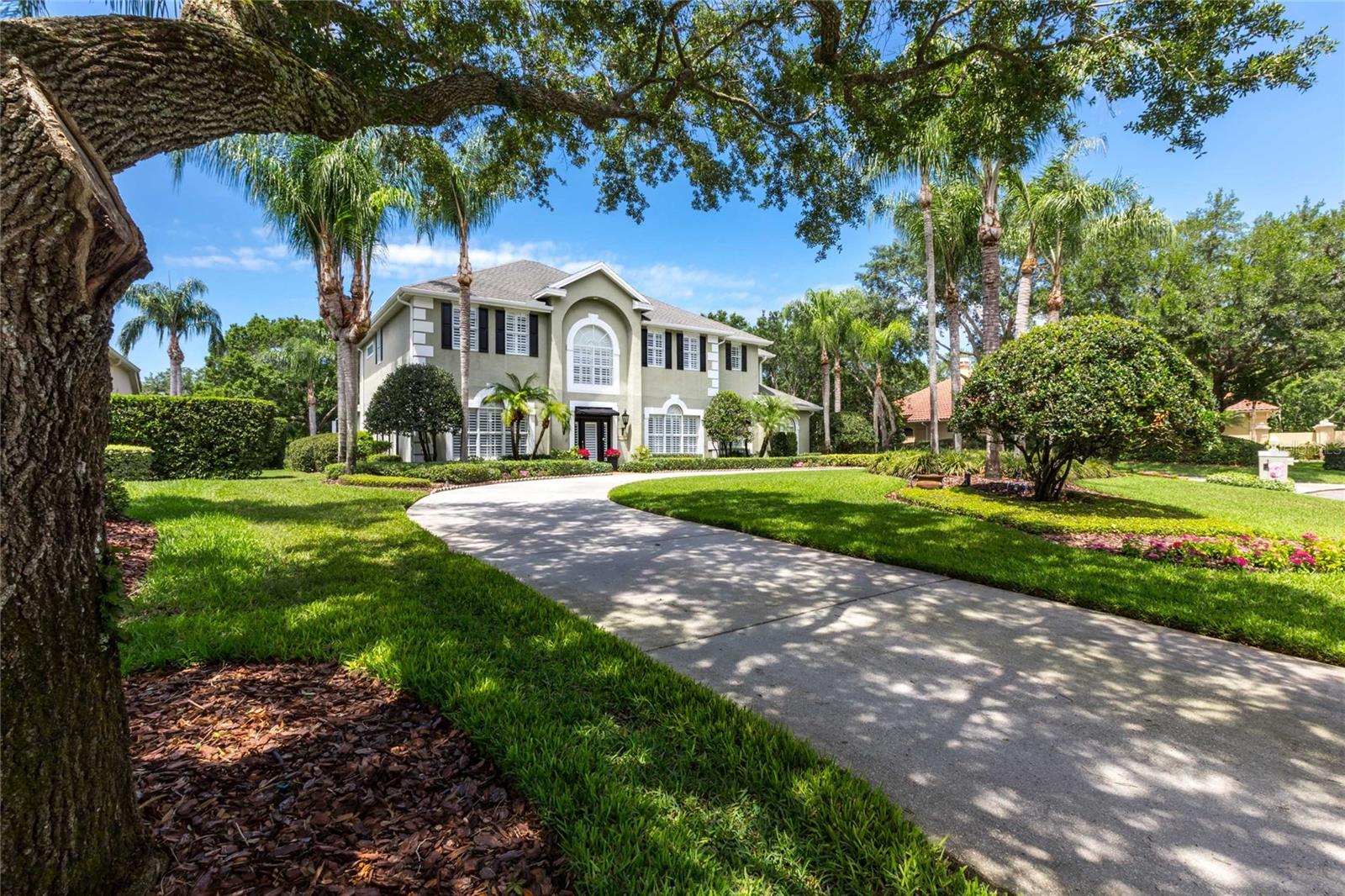 One or more photo(s) has been virtually staged. Price Reduced! Bring Offers! Nestled in the heart of AVILA, Tampa Bay's most prestigious GATED GOLF COURSE COMMUNITY, discover this magnificent luxury home that exudes elegance and is METICULOUSLY MAINTAINED. This striking 2-story residence spans 5,745 square feet and is situated on a TRANQUIL POND CONSERVATION property, approximately .75 ACRES in size, offering unparalleled peace and seclusion. The home features 6 bedrooms, 5 full and 1 half baths, HEATED POOL AND SPA, GENERATOR for the main house, 4-CAR garage, and a truly EXCEPTIONAL SPACE KNOWN AS THE “CULINARY ENTERTAINMENT SUITE.” This unique addition to the home showcases a state-of-the-art commercial kitchen, sophisticated bar, and a dedicated guest bedroom, masterfully designed to blend functionality with style. The CULINARY ENTERTAINMENT SUITE serves as the perfect venue for hosting extravagant events, indulging in gourmet experiences, converting to an entertainment suite, and/or providing a private sanctuary for your guests. Upon entering the home, be captivated by the WOOD FLOORING, crown molding, and elegant SHUTTERS adorning the main living areas. The primary kitchen boasts granite countertops, double oven, center island, slate backsplash, expansive walk-in pantry, and a welcoming dinette area. Entertain with sophistication in the formal dining room, accentuated by chair rail molding and a convenient butler's pantry. Unwind in the cozy family room, complete with a welcoming FIREPLACE. First floor also features a formal living room/study, and a half bath. Ascend to the second floor to discover five generously sized bedrooms, including the primary suite, each providing an equal balance of comfort and space. Experience the unmatched allure of the entertainment suite, highlighted by stained concrete flooring, stacked brick wall, built-in granite-topped buffet, and walk-in bar outfitted with a refrigerator, wine refrigerator, and granite countertops. The culinary kitchen showcases a stainless steel island with double sinks and sprayers, Champion under-counter 90-second dishwasher, 10-burner Vulcan gas stove, Larkin 12-foot hood with Make-up Air fan, Deep fryer, CPG char-broiler, pot rack, Manitowoc under-counter ice-maker. A guest bedroom with full bath completes this versatile space. Venture outdoors to the screened lanai with full bath, where a heated pool and spa beckon, surrounded by attractive brick pavers. Savor alfresco dining with the REMOTE CONTROL SCREEN and entertain beneath the patio lights while watching TV. Serene lot on the pond creates a picturesque backdrop, inviting you to enjoy the beauty of nature while experiencing a sense of tranquility. AVILA is a luxurious gated community offering privacy, security, and top-notch amenities. Enjoy 24/7 SECURITY and beautiful park with playground, SOCCER field, running path, basketball and PICKLE-BALL COURTS, DOG PARK, and pavilion. Within Avila, the prestigious AVILA GOLF AND COUNTRY CLUB features JACK NICKLAUS-DESIGNED 18-HOLE golf course, practice facility, clubhouse, tennis courts, pro-shops, fitness center, and pool pavilion. The club is separate entity that requires an application for membership with fees and dues. Embrace the luxurious lifestyle that awaits you in this stunning home that lets you entertain with flair, and CREATE CHERISHED MEMORIES with family and friends, all within the exclusive and secure confines of the prestigious Avila community.