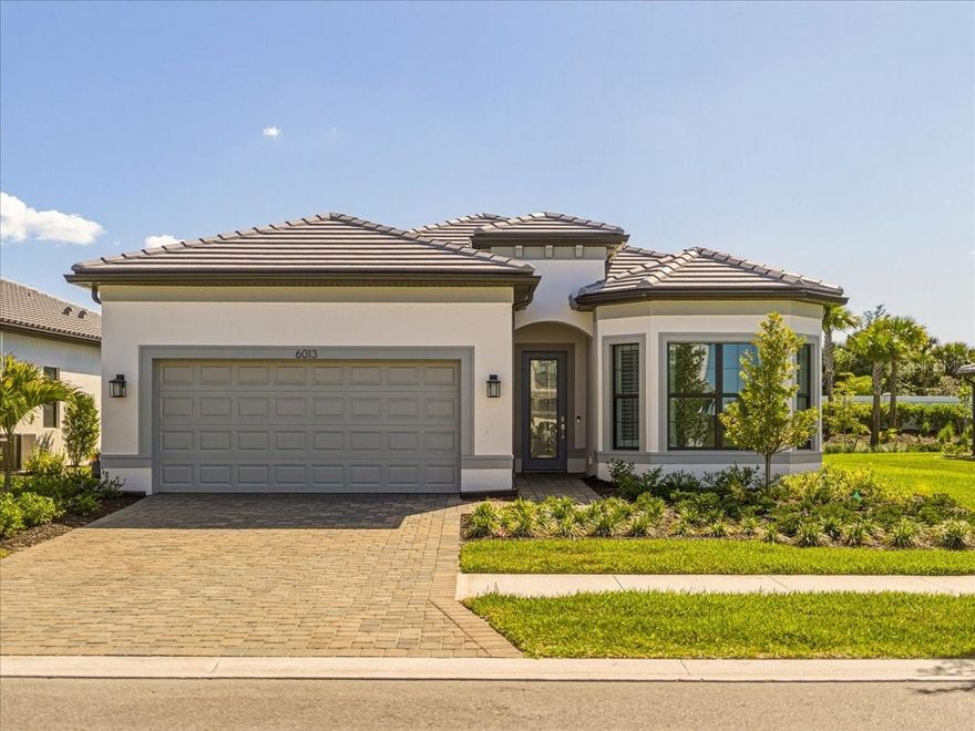 Built in 2025 and move-in ready today, 6013 Silver Grass Court is a meticulously crafted 4-bedroom, 2-bath home situated on an oversized 8,900 square foot lot in the gated, resort-style community of Talon Preserve on Palmer Ranch in Nokomis, Florida. For buyers searching for a brand-new construction home with premium finishes, a natural gas community, hurricane impact windows, and world-class amenities in Sarasota County, this home delivers on every level. The moment you enter, the craftsmanship is undeniable. Soaring 10-foot 8-inch ceilings and 8-foot interior doors create a grand, open atmosphere that flows through the entire home. The living room features a beautiful tray ceiling that adds architectural depth and elegance, and the zero-corner pocket sliding door opens fully to the screened lanai, seamlessly merging indoor and outdoor living in the way that only the finest Florida homes can. Porcelain wood plank floors run throughout every room of the home, offering the warmth and beauty of hardwood with the lasting durability that Florida's climate demands. Plantation shutters frame every window, adding a classic coastal elegance and precise light control throughout the day. The open-concept kitchen is designed for serious cooking and relaxed entertaining. Quartz countertops, a functional vented hood that genuinely performs, stainless appliances, and a generous island anchor a kitchen that flows naturally into the dining and living areas. The home is connected to natural gas, a meaningful advantage for cooking, water heating, and long-term efficiency that buyers in the know specifically seek out. The split floor plan provides genuine privacy, placing the primary suite on one side of the home and the three guest bedrooms on the other. The oversized laundry room adds a level of everyday practicality that is rare in homes at this size and price point. The deep two-car garage offers exceptional storage and flexibility far beyond what a standard garage provides. The HVAC system has been properly sized for the square footage of this home, ensuring efficient, consistent comfort year-round, a detail that matters far more than most buyers realize until they are living it. Every window and exterior door is hurricane impact rated, providing whole-home storm protection, superior noise reduction, and significant insurance benefits. This is not a partial upgrade. It is complete, built-in protection from the ground up. The home sits on one of the larger lots in the community at 8,900 square feet, providing extra space, privacy, and room to add a pool. Step outside to the screened lanai and you have the perfect setting for morning coffee, evening dinners, and everything in between. Talon Preserve on Palmer Ranch surrounds this home with an 18,000 square foot grand clubhouse, resort pool, heated spa, splash pad, 8 pickleball courts, 2 tennis courts, 4 bocce courts, a state-of-the-art fitness center, fire pit lounge, dog park, playground, walking trails, and a full-service restaurant bar and grill. Nokomis Beach, Venice Beach, Oscar Scherer State Park, downtown Venice, and I-75 are all minutes away. Talon Preserve on Palmer Ranch · 6013 Silver Grass Court · Nokomis FL 34275 · Sarasota County