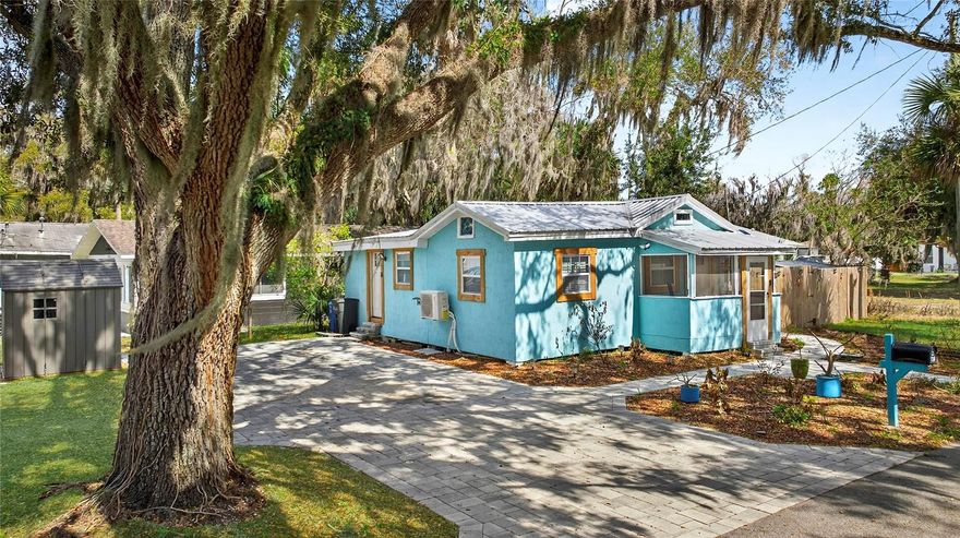 Completely reimagined and beautifully restored, this charming 1939 New Smyrna Beach home offers the perfect blend of historic character and modern upgrades. This one-bedroom, two-bathroom property has just undergone a full studs-in renovation, meaning virtually everything is brand new while maintaining the charm of an original beachside cottage. The extensive renovation includes new electrical, all new lighting, closed-cell foam insulation, new doors and windows, new flooring, and two beautifully designed bathrooms, including one featuring a relaxing jetted tub. The kitchen has been completely rebuilt with quartz countertops, stainless steel appliances, and stylish modern finishes. A newly added loft with drop-down attic stairs provides additional flexibility and storage, while LED recessed lighting throughout and a three-zone mini-split A/C system keep the home comfortable year-round. Situated on a spacious corner lot directly across from a large community park offering tennis courts, pickleball, basketball, a skateboard park, squash courts, and more, the location is exceptional. Just a few blocks from New Smyrna Beach’s vibrant downtown filled with shops, restaurants, and local charm, approximately one mile from the Intracoastal boat ramp and marina, and only 2.5 miles to the beach, this property offers the ultimate coastal lifestyle. The oversized city lot is a rare find and provides ample space to build a large shop, bar, or guest house if desired. Outdoor living has been thoughtfully enhanced with more than $35,000 invested in paver driveways, walkways, and patios. There is also a fenced area on one side of the property and three storage sheds, one of which was designed to serve as a future outdoor bath house for a hot tub area and is ready for plumbing. Perfect for those who love the idea of a tiny home lifestyle with room to expand, this home is cute, quaint, completely updated, and truly move-in ready — essentially a brand new old house in one of New Smyrna Beach’s most desirable locations.