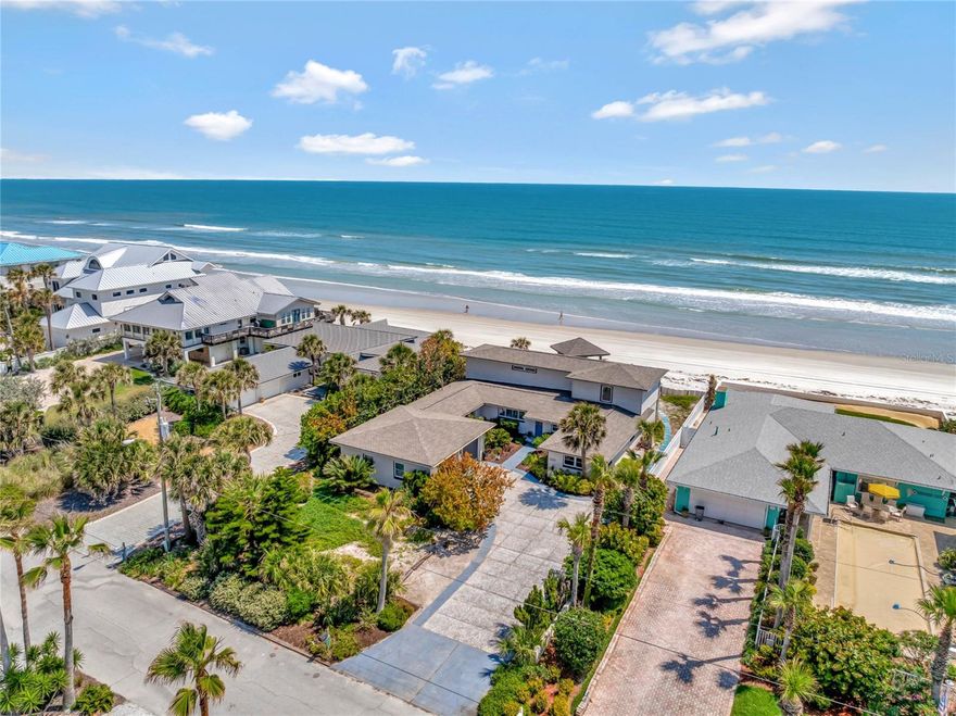 Don’t miss your chance to own one of only 38 exclusive homes on the highly desirable only No Drive area of New Smyrna Beach. Indulge in coastal luxury living at its finest with this exquisite oceanfront beach home. Immerse yourself in the beauty of the sunrise and the endless ocean vistas from the expansive patio, deck, and nearly every room throughout the house. Relaxation awaits you in the primary bedroom retreat, where you'll awaken each morning to the mesmerizing sight of the ocean. Pamper yourself in the remodeled spa-like primary bath, complete with a luxurious tub where you can unwind while gazing at the tranquil waves. This tastefully updated residence boasts three of four bedrooms with ensuite baths, and a bonus room currently utilized as a fifth bedroom, perfect for added versatility and enjoyment. Experience beach life at its finest with room for your kayaks and surfboards in the oversized garage. Many updates include Smart Thermostat and Door Lock, New Frigidaire Refrigerator, Dishwasher, and Range 2022, HVAC replaced in 2021, 2 new water heaters in 2019, new roof 2016, Electrical Panel Updated and added Voltage, 22 windows replaced w Hurricane grade double pane 2016, including the 5 by 5 GRAND window in Primary bath. Minutes from the charming downtown of New Smyrna Beach with galleries, boutiques, restaurants, and entertainment, this coastal retreat offers an unparalleled lifestyle experience, epitomizing the pinnacle of coastal living.