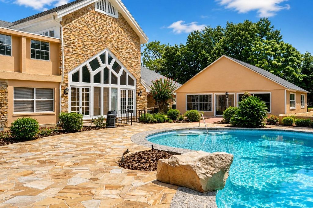Photo of 1041 Sweetwater Club Boulevard, Longwood, FL 32779 (MLS # O6425075)