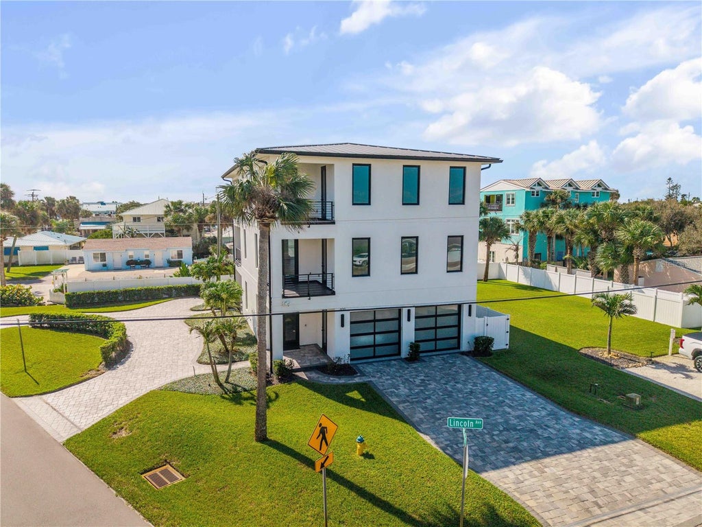 Photo of 409 Lincoln Avenue, New Smyrna Beach, FL 32169 (MLS # O6452751)