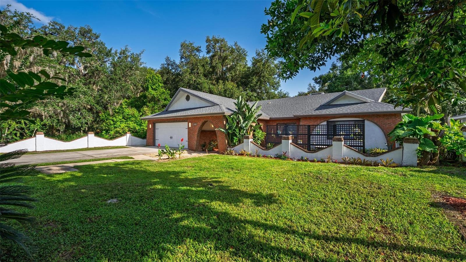 Price Reduction!!! Come see this beautiful home before it is gone. THIS IS A ONE-OF-A-KIND WATERFRONT SPANISH MEDITERRANEAN RETREAT! — a unique, custom-built home that blends timeless elegance with Florida’s natural beauty. This one-of-a-kind Spanish Mediterranean estate is an entertainer’s and fisherman’s dream, located on a private canal with direct access to Lake Harris.
Enjoy 2 covered docks, one with a boat lift, nestled in your own private lagoon, just 15 minutes by boat to Venetian Gardens! Whether you're casting a line or cruising to dinner, this home is perfectly positioned for waterfront living. The secret garden oasis surrounds the home with lush flower beds and tropical fruit trees—including orange, pineapple, banana, and dragon fruit.
The open concept interior features 4 bedrooms, 3 bathrooms, and spacious living areas perfect for entertaining or relaxing. The primary suite includes a walk-in closet, serene views, and custom finishes throughout.
Located just minutes from Downtown Leesburg, the Florida Turnpike, and Clermont, this property offers the perfect blend of peaceful retreat and everyday convenience.
This is a place you must come, sit down, and feel the calm, relaxing energy of the home. Truly soak in the secret garden feel, complete with a private fenced side yard—perfect for children, pets, or even a private business entrance.
Don’t miss your opportunity to own this unforgettable slice of paradise!