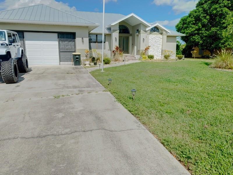 Step into this spacious, fully furnished home AVAILABLE FOR LONG AND SHORT-TERM SEASONAL rental in the desirable Punta Gorda Isles community. This beautiful waterfront retreat features a sparkling pool overlooking the canal, along with a private dock and boat lift — perfect for enjoying Florida’s boating lifestyle. The home offers 3 bedrooms and 2 full baths, plus a large garage equipped with ample counter space and a convenient sink. The open-concept kitchen sits at the heart of the home, seamlessly connecting the living and family rooms — an ideal setup for entertaining family and friends. With abundant closet and cabinet storage throughout, you’ll have plenty of space to settle in comfortably. Don’t miss the opportunity to stay in this stunning waterfront getaway — relax by the pool, take your boat out for a sunset cruise, and experience the best of coastal living in Punta Gorda Isles. Just bring your suitcase and swim suit for a relaxing stay with us for 3 months, 6 months or a year, this home is ready to help you enjoy the Florida lifestyle. Rates vary by month and lease term length. Current rental rate does not reflect short term lease 12% transient tax amount.