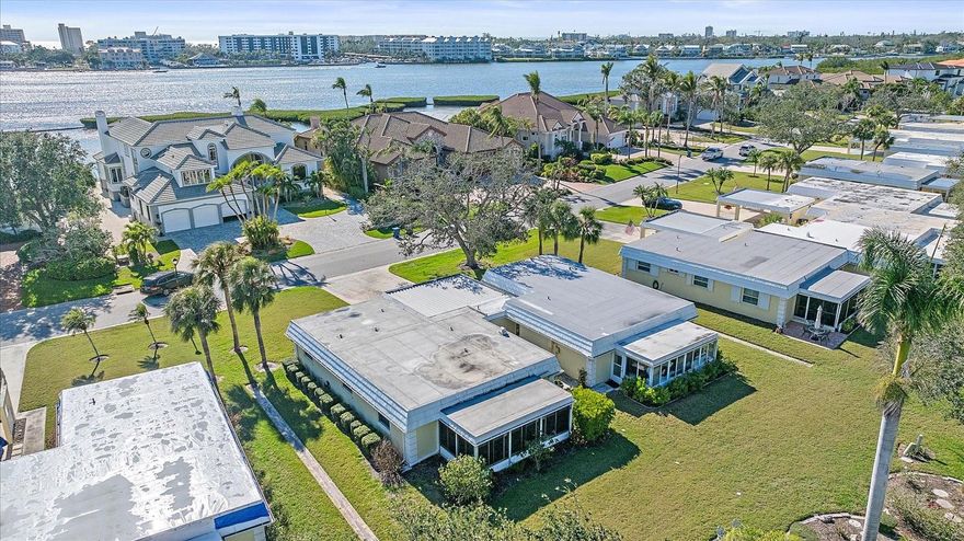 Discover coastal living at its finest in this meticulously maintained and updated villa. This two-bedroom, two-bathroom residence boasts 1,155 square feet of thoughtfully designed living space, featuring top-quality finishes throughout. Including an open floorplan for entertaining, spacious owners suite that features a walk-in closet with a private updated bathroom with walk in shower. Right outside the additional bedroom you'll find an additional fully updated bathroom with a second walk in shower.

The heart of this home showcases a versatile Florida room that seamlessly connects with the main living area, allowing you to curate your ideal indoor-outdoor experience. Enjoy the custom window treatments. Open the windows to welcome gentle bay breezes or close the sliders for a climate-controlled retreat.  Recent upgrades include NEW Appliances, Impact-resistant Windows, 2017 ROOF, and comprehensive Replumbing completed in 2018. In 2022, the AC Unit was replaced. 

Baywood Colony delivers an array of resort-style amenities that cater to an active lifestyle and breathtaking views of Little Sarasota Bay. Residents enjoy access to a heated swimming pool, rejuvenating sauna and engaging billiards room. The community clubhouse serves as a hub for social gatherings and events, fostering a welcoming atmosphere among neighbors.

This pet-friendly community's prime location puts you minutes from Siesta Key's renowned beaches and the historic Phillippi Estate Park. Enjoy spectacular sunset views from your own neighborhood while being conveniently situated near exceptional dining establishments and shopping destinations.

Experience the perfect blend of coastal living and modern convenience in this thoughtfully appointed waterfront residence. The combination of premium features, community amenities, and an unbeatable location creates an exceptional opportunity for your next chapter in paradise.