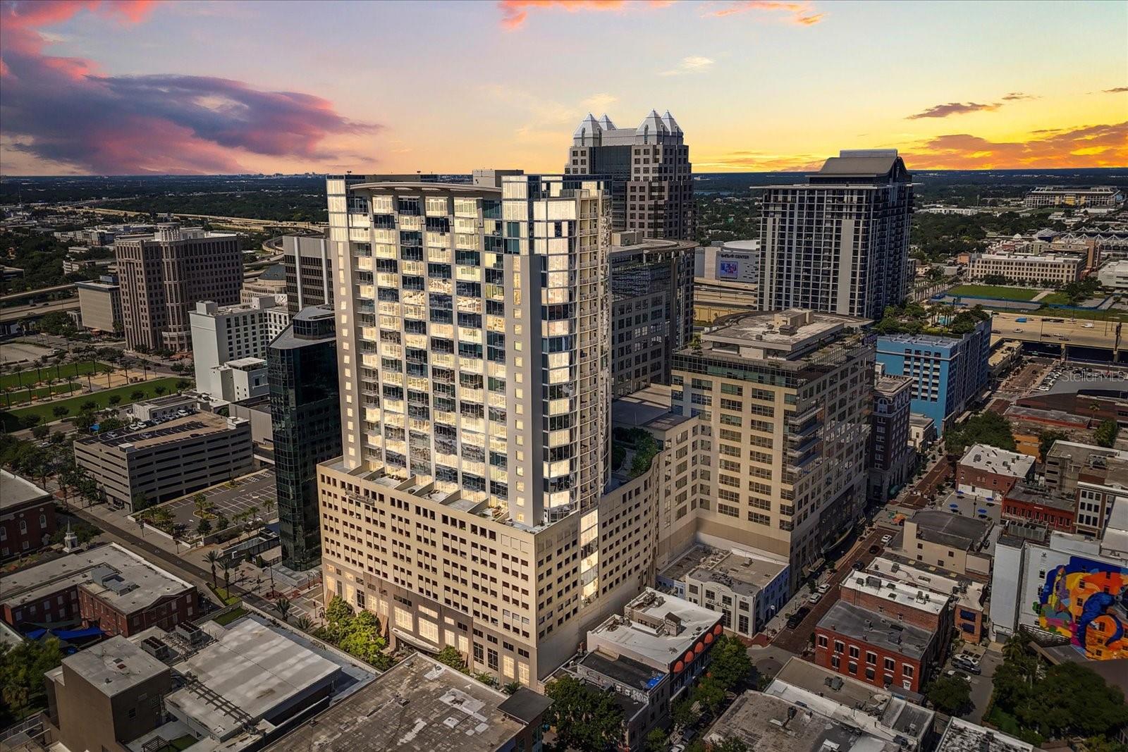 High-rise living meets high-impact design in this luminous 13th-floor residence at Solaire at the Plaza—where every sunrise and sunset becomes part of your daily rhythm. Step inside and feel the pulse of Downtown Orlando come to life through soaring floor-to-ceiling windows that flood the open-concept layout with natural light and panoramic city views. This is more than a home—it’s a statement of style and sophistication.
The kitchen is a showpiece, blending sleek quartz countertops, a dramatic waterfall island, and stainless steel appliances with custom cabinetry that seamlessly flows into the living and dining spaces. Whether you're hosting an intimate gathering or enjoying a quiet night in, the energy here is both vibrant and inviting.
Every inch of this 2-bedroom, 2-bath sanctuary has been thoughtfully curated, from the oversized designer matte tile flooring to the spa-inspired primary bath with dual vanities and a glass-enclosed walk-in shower. The primary suite features a custom walk-in closet and dazzling skyline views, while the second suite offers equal measures of luxury and light. Step out onto the private balcony and watch the city unfold beneath you—this is the magic of living above it all.
Solaire at the Plaza offers resort-style amenities including a sparkling pool, fitness center, 24-hour concierge and security, and a resident clubhouse. With two assigned parking spaces, convenience is effortless. Outside your door, Downtown Orlando offers an all-access pass to entertainment, dining, and culture: Lake Eola, Kia Center, Dr. Phillips Performing Arts Center, and Orlando City Soccer Stadium are all just a short stroll away. Whether you're seeking modern elegance, unmatched views, or the buzz of urban life—residence #1316 delivers it all, with style.