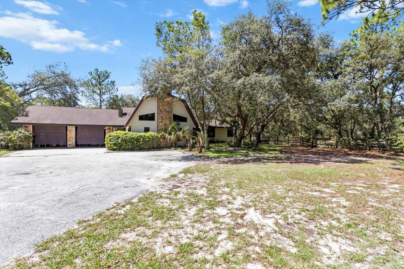 PRICE IMPROVEMENT WITH NEW ROOF AT CLOSING!! No HOA or deed restrictions at the end of a private paved road! This 5-acre property is ready to move in and bring the horses. Home boasts 3 large bedrooms and 2 baths, eat in kitchen is open to the dining room, living room, and separate great room with a stone fireplace. Upstairs loft can be a fourth bedroom, office or hobby space. Your horses will love the 20’x50’ shedrow barn designed for optimal airflow, featuring four stalls each with an open area for feed or hay, while each stall has a 30ft corral run and all runs connect to turnout paddocks. Amenities include a wash rack, open tack area, and a separate 12’x12’ pavilion with corral, perfect for additional stabling or equipment. Horse lovers will appreciate the 100’x100’ paddock and can serve as a small arena, with two additional paddocks. Open wooded area is great for hacking the property and room for 60 ft round pen exists. Approximately two acres of open space ideal for adding more paddocks, a round pen, or another barn to suit your equestrian needs. Property is fully fenced with separation for dogs, goats or any other family pets! Centrally located and directly abutting the sought-after Pine Ridge Equestrian community. Too much more to list, must see!