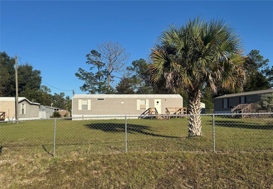 Welcome home to this meticulously maintained 2-bedroom, 2-bath single-wide manufactured home in Williston, Florida! Perfectly situated between Gainesville, Ocala, and the World Equestrian Center, this property offers convenience, comfort, and incredible value. Owned seasonally since new, the home shows true pride of ownership with a spotless interior, durable metal roof, vinyl siding, and a fully fenced yard. Enjoy your morning coffee on the 12x12 front deck or unwind in the evening on the 10x10 rear deck. Inside, the home is bright, inviting, and move-in ready—with all-electric utilities, high-speed fiber internet available, and optional furnishings for an easy transition. The property is an original set-up, making it financeable and insurable for a variety of loan types. Whether you’re looking for a seasonal retreat, a full-time residence, or an affordable investment near the World Equestrian Center, this home checks all the boxes. Vacant and easy to show, this home will not disappoint!