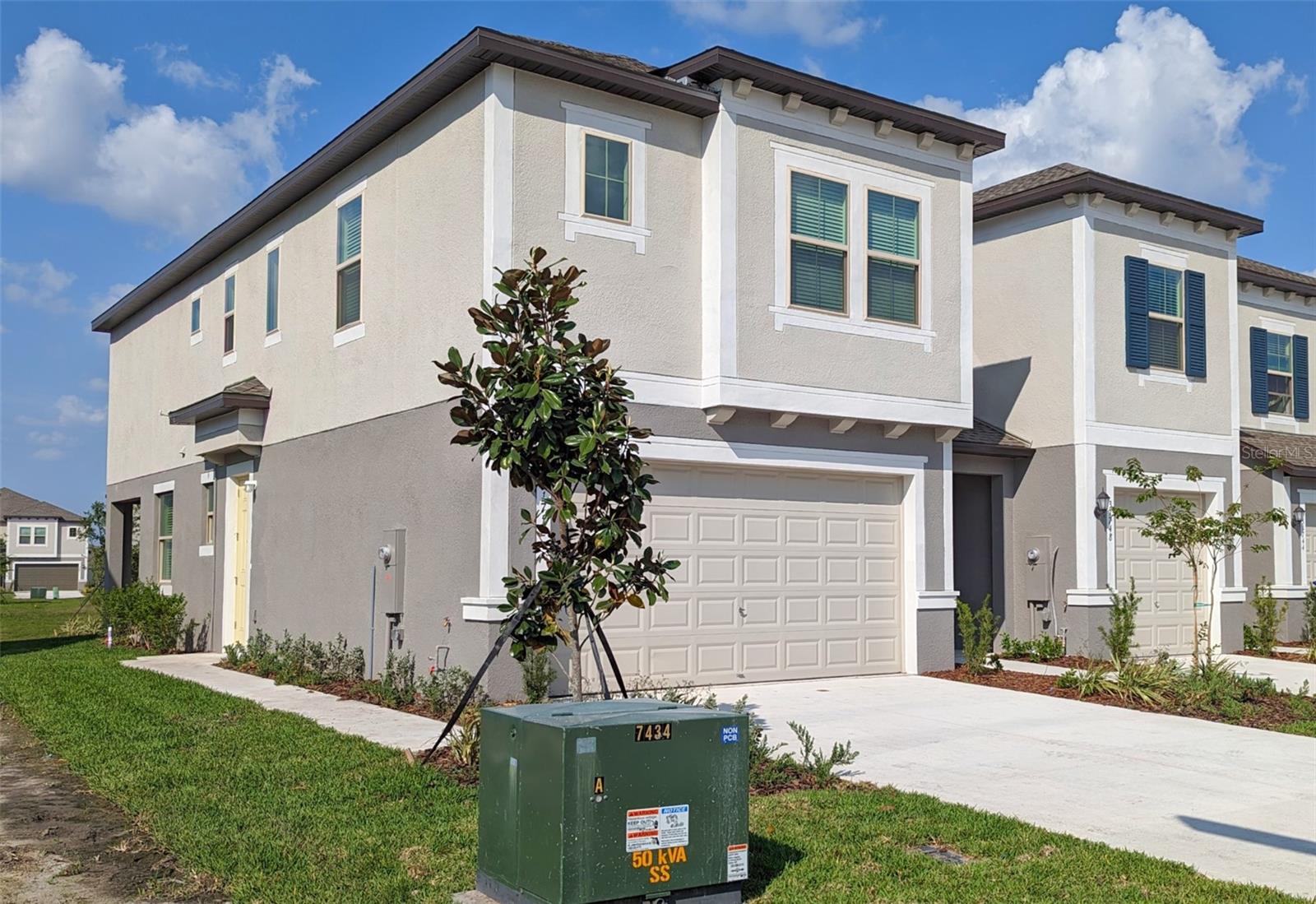 LIVE THE FLORIDA RESORT LIFESTYLE IN THIS NEW TOWNHOME NEAR A CRYSTAL LAGOON! Welcome to Epperson, a fast-growing destination on Florida's West Coast with a unique blue lagoon water park at the heart of its social and recreational opportunities! You'll love this smartly designed home on the loop street closest to the fun. It's also the biggest of the 3 townhome models here: an 1,807-SF end unit, which delivers more windows and more light, with a 2-car garage while others have only a single or none. You get 3 bedrooms, 2.5 baths, plus high-quality amenties ranging from tile, wood and granite to crown molding, undermount sinks and stainless-steel appliances. Even the washer and dryer are provided! It also offers a screened lanai overlooking a pond northward, so you can enjoy both sunrise and sunset without facing direct rays. Your front door is actually a side entry to a wide-open living / dining space and kitchen with center island, butler's pantry and plenty of shaker-style cabinets. A half-bath for convenience completes the downstairs layout, while all bedrooms and both full baths are upstairs along with a laundry room and a bonus loft landing for work or play flexibility. In addition to your garage and private driveway, you'll find guest parking spaces directly across the street and the mailbox center just around the bend. Epperson amenities are impressive even beyond the 7-acre lagoon with cabanas, water slides, swim-up bar and more. You'll find parks, trails, sports and fitness facilities, event pavilions and a great community vibe. Your rent includes lawn and landscape, basic cable and high-speed online service, as well as local professional management of this specific townhome for your reassurance. Epperson is just minutes from Interstate 75 for easy access to shops, restaurants, arts and entertainment, beaches and so much more. Clearly you can see this is more than just another rental, so make it yours today!