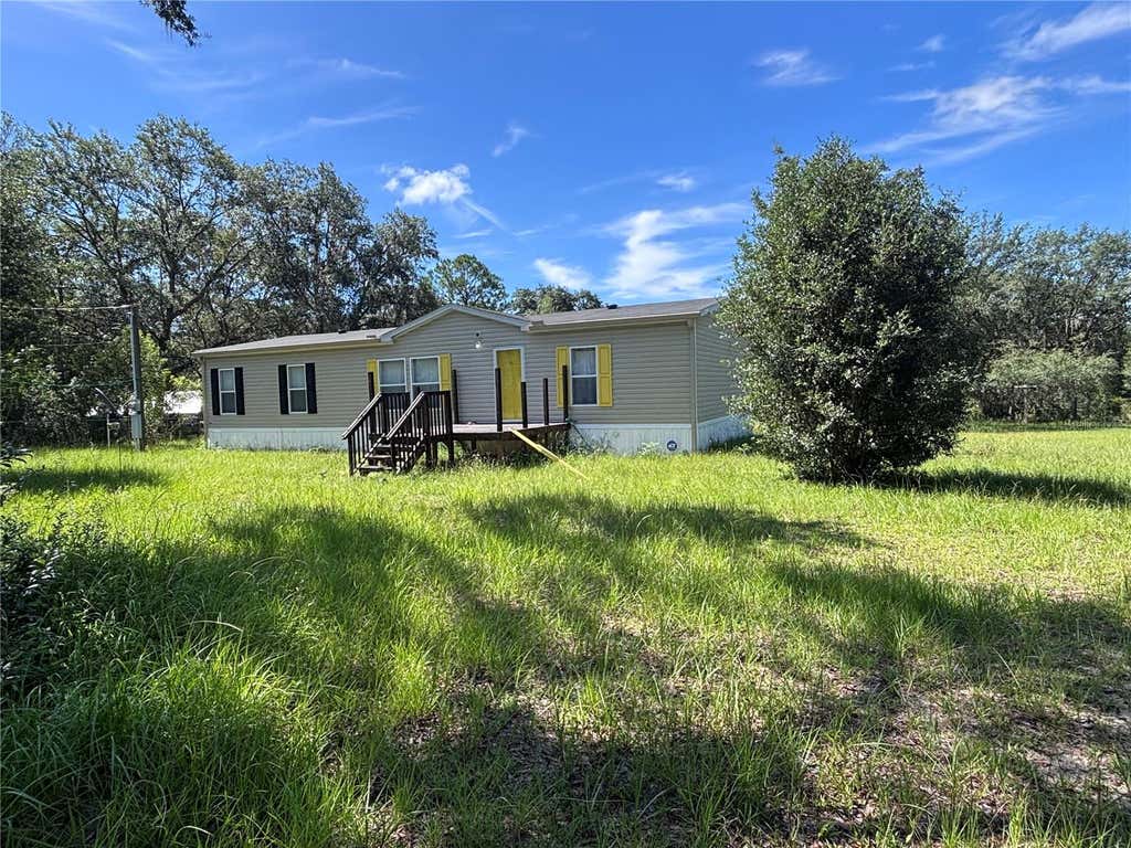 Photo of 133 Oak Circle, Interlachen, FL 32148 (MLS # GC542835)