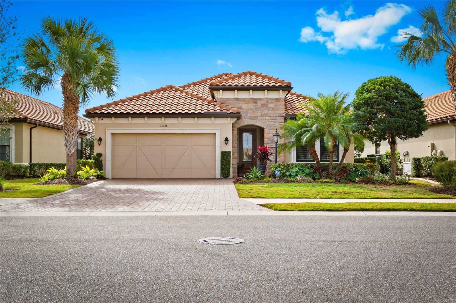 Live the dream in the distinguished resort community of ESPLANADE GOLF & COUNTRY CLUB. This stunning home is modern elegance at its finest and has been meticulously maintained! PICENO MODEL FEATURES: 2 Bedroom/2 bath + Den with everything you could ever want in a home! Gorgeous ceramic tile flooring was RECENTLY INSTALLED throughout the main living areas and both bathrooms have been COMPLETELY RENOVATED. NO DAMAGE from any of the recent storms and you are in an X Flood Zone so NO need for Flood insurance.
The KITCHEN is a chef's dream with a massive Cambria Quartz Island with extra storage, Stainless Steel LG Appliances, Under Cabinet Lighting, Gas Range, Wine Fridge, Custom Pantry, Glass Backsplash, and Built-In Desk.
Enjoy a meal in the DINING ROOM or lounging in the GREAT ROOM with exquisite tray ceilings in this amazing open floor plan.
The OUTDOOR KITCHEN with EXTENDED LANAI and NEW TILE FLOORING features Granite Countertops, Grill & Hood, Side Burner, Ice Chest, Sink, Fridge, Pull Out Garbage, and Bar area for your guests to sit while enjoying a piece of paradise. There is also a Remote-Control Hurricane Shutter for extra protection.
The PRIMARY BEDROOM presents 2 Walk-In Custom Closets, Ensuite Bath with Split Dual Vanities, Step-In Shower, Lighted Mirrors and Water Closet.
The DEN boasts built-in shelving and dual desk space with LED lighting and Double Glass French Pocket Doors with pull-down shades for complete privacy.
The LAUNDRY ROOM includes Built-in Cabinetry, Sink, LG Front-Load Washer & LG Front-Load Dryer with pedestals. Continue to be impressed as you enter an immaculate garage. The GARAGE space is equipped with Built-In Cabinets, Work Bench, Ceiling Racks, and Epoxy Flooring.
OTHER FEATURES INCLUDE: Updated Light Fixtures, Fans, and LED Lighting throughout, Plantation Shutters, Ring Doorbell, Tray Ceilings, Hunter Douglas Automatic Shades Across Sliders in the Great Room, Built-In Surround Sound with Indoor & Outdoor Speakers, Whole House Generator, Landscape Lighting, Gutters, New A/C and Water Heater, Glass Front Door, Motion Sensor Security Light & Alarm System, Roof was recently cleaned and front entrance/Lanai have extra hurricane protection shutter system.
INCLUDED IN HOA DUES: Resort Style Community Pool with Cabanas and Poolside Bar, Fitness & Wellness Center, Spa, Culinary Center, Tennis, Bocce Ball & Pickleball Courts, Clubhouse, Playground, 2 Dog Parks, Full-Time Activities Director, Onsite Property Management & Maintenance, Lawn Maintenance, Manned Gate on Malachite. GOLF IS NOT INCLUDED IN THE HOA DUES. However, Club members can still play!
AMAZING LOCATION: Close to shopping (UTC Mall), restaurants, Sarasota International Airport, and the top-rated beaches in the country.