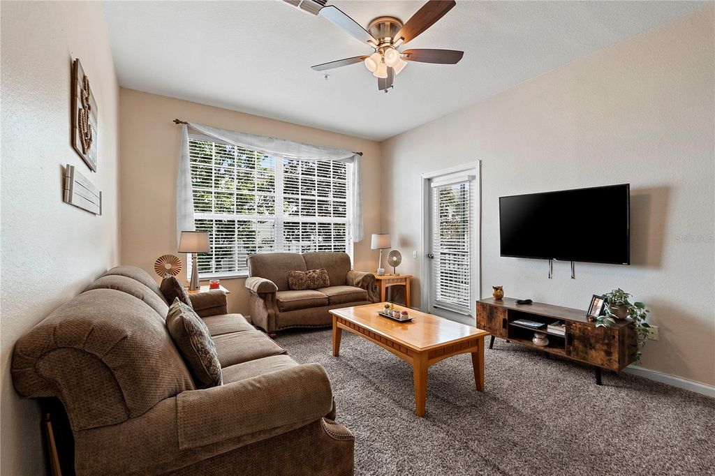 Photo of 8103 Coconut Palm Way #205, Kissimmee, FL 34747 (MLS # O6406739)