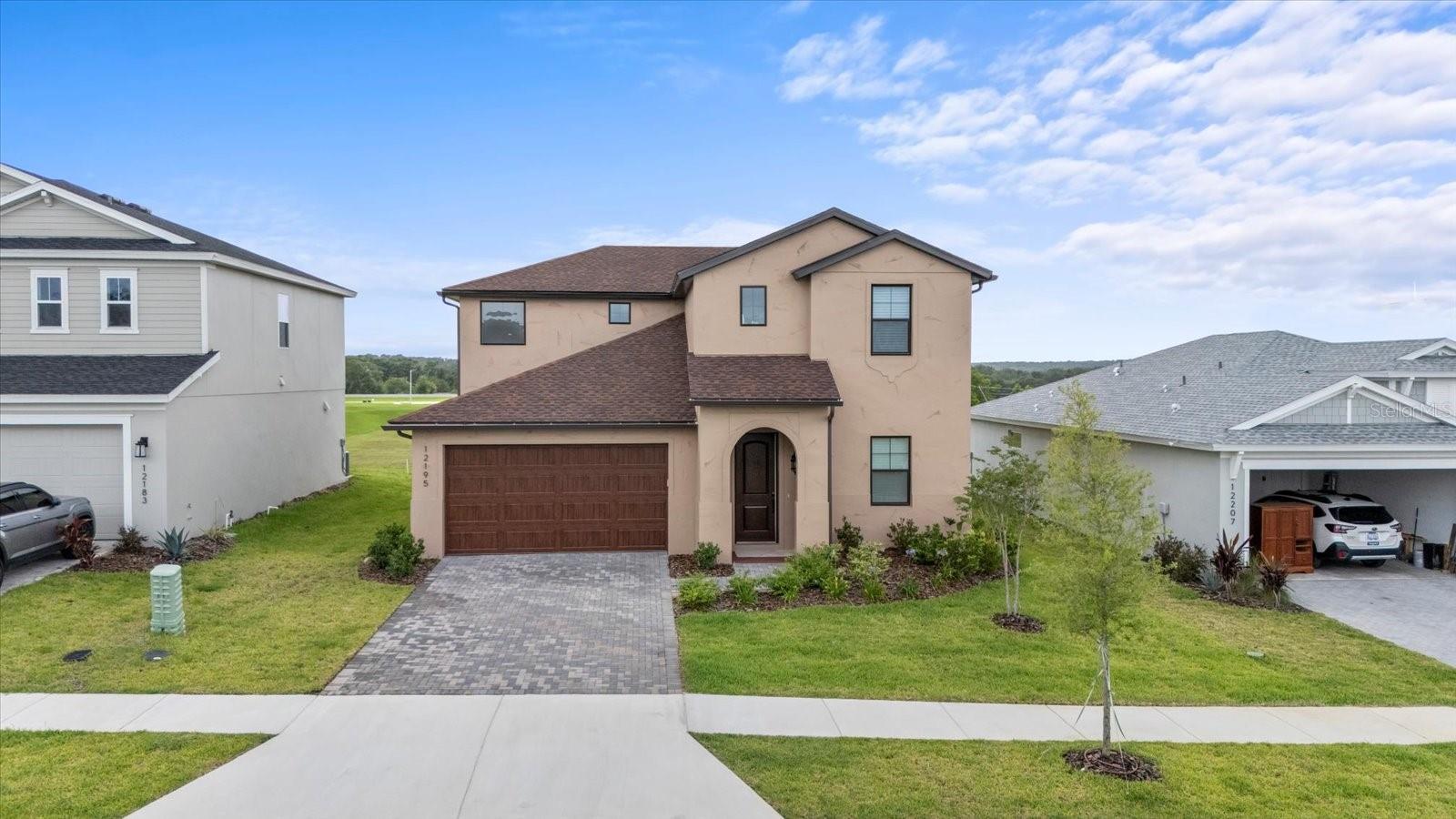 Tired of the same cookie cutter home with no view. Well, we have great news for you! Look no further. This stunning open concept two story home nestled in the peaceful community of Hilltop Point in Dade City, FL. You can wake up to a beautiful sunrise or wait till sunset to admire the view. This meticulous crated home is 2,711 Sq Ft with many upgraded features. The owners have also screened the lanai and added gutters to the entire home. This home has an upgraded gourmet kitchen and 42''inch cabinets. It also has lot of storage, like the walk in kitchen pantry, office spaces and closets. Additional features include 8' tall interior doors on both levels, ceiling fans in all of the bedrooms, Smart Home technology, and energy star certified. You will be amazed by the amount of natural light that comes through the windows and sliders, and best of all there is no rear neighbors because there is a retention pond behind this home. This beautiful house is minutes away from restaurants and stores in the area and mins away from Wesley Chapel and Mirada Lagoon. Don't miss out, make an appointment to see this amazing home today!