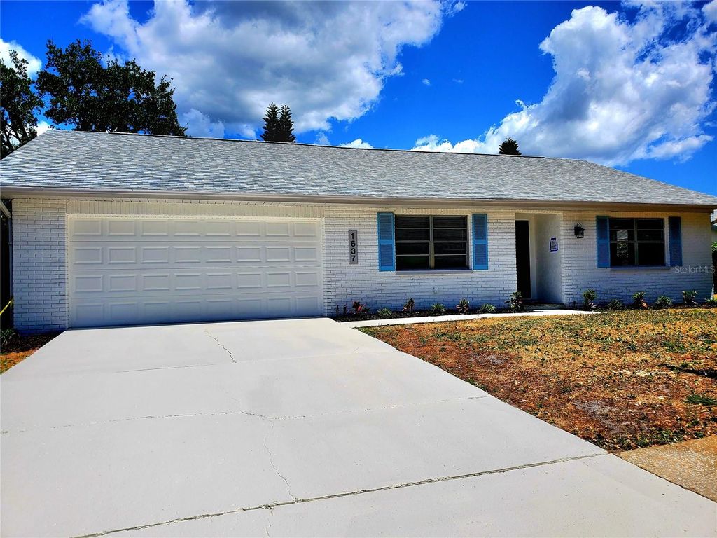 Photo of 1637 Caledonia Drive, Palm Harbor, FL 34684 (MLS # TB8492628)