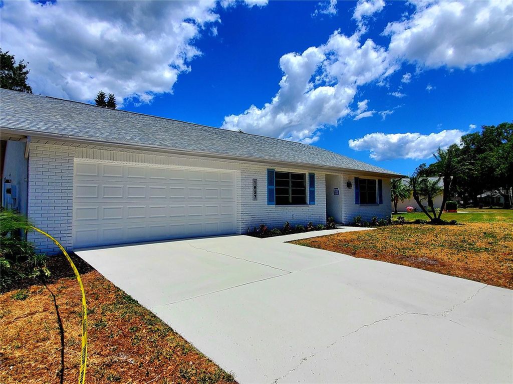 Photo of 1637 Caledonia Drive, Palm Harbor, FL 34684 (MLS # TB8492628)
