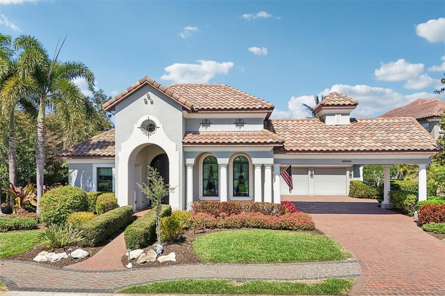 One or more photo(s) has been virtually staged. Experience refined coastal luxury in this exceptional custom estate by Arthur Rutenberg, offering 3,574 square feet of impeccably designed living space defined by architectural detail and elevated craftsmanship. A grand arrival begins at the oversized iron-and-glass front door, framed by nine stately white columns along the expansive porch and porte-cochère—an unforgettable statement of symmetry and scale. Inside, exquisite details abound, including cracked-stone ceiling accents, soaring wide-profile entryways, and a thoughtfully curated floor plan that balances elegance with functionality. The $40,000 chef’s kitchen is truly a triumph of stone and steel, and flows effortlessly into an expansive living suite designed for large-scale entertaining renovation is a true showpiece, featuring an oversized statement island, dual stainless steel ovens, and premium Moen and InSinkErator fixtures, flowing seamlessly into an expansive living area ideal for refined entertaining. The Executive Tower Suite redefines work-from-home living with dual-level design, integrated wet bar, dual wine refrigeration, panoramic canal views, two walk-in closets, and a private bath—making this space less a room and more a destination. Positioned 10 feet above flood level, the home boasts a flawless no-flood history, offering rare peace of mind for a waterfront estate. Superior systems include dual HVAC units (2018), EV charging outlet, reverse osmosis water filtration with exterior salt softener, continuous hot water system, overhead garage storage, and professionally maintained lawn and termite protection. The home is equipped with a fully integrated whole-house generator by Generac, providing seamless backup power and peace of mind year-round. Outdoors, an artistically curved saltwater pool with heated spa creates a private resort-style retreat. 508 Mast Drive is not simply a home—it is a confident waterfront statement blending executive functionality, architectural distinction, and refined coastal living. Perfectly located near world-class Gulf beaches, UTC shopping and dining, and Sarasota-Bradenton International Airport, this is a rare opportunity to own a luxury waterfront estate of this caliber. Private showings by appointment.