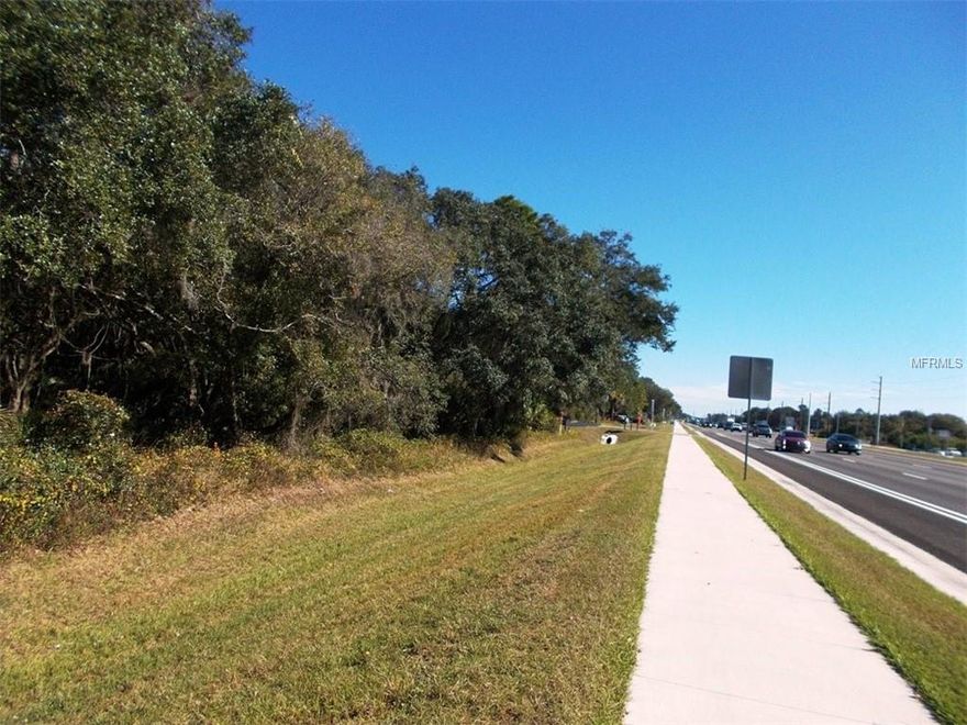 Commercial Lot with frontage on US41, located between Port Charlotte Murdock Circle and Downtown North Port. Convenient location in growing area with high traffic and  comfortable access to shopping mall, restaurants, businesses, etc. Tamiami Trail is significantly expanded and improved recently. New construction of hospital, water park and recreational development will begin soon. Hurry to buy, it will go fast!