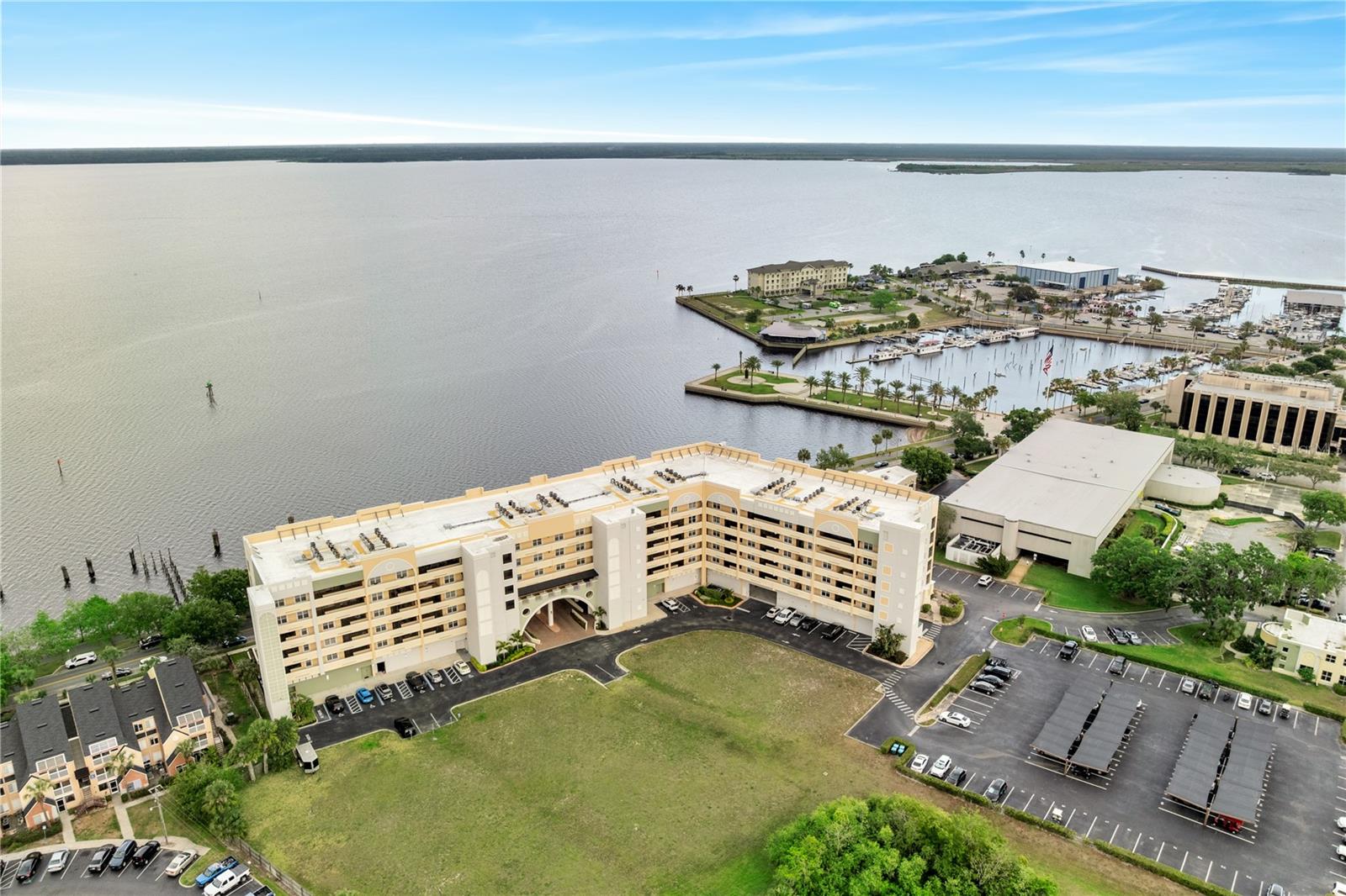 Experience luxury waterfront living at 225 W Seminole Blvd Unit 409 for $3,409/month a spacious 3-bedroom, 3.5-bath corner unit with ~2,585 sq ft in the desirable Gateway at Riverwalk community. This 4th-floor condo offers panoramic views of Lake Monroe from a stunning wraparound screened balcony, Italian porcelain and hardwood floors, an open-concept living area, and water views from almost every room. The split-bedroom layout includes a lavish primary suite with dual closets and spa-style bath, plus two private guest suites. Enjoy gated access, a clubhouse, fitness center, garage parking, and walkability to Sanford's historic downtown, marina, and Riverwalk. Pet-friendly (1 pet up to 30 lbs).