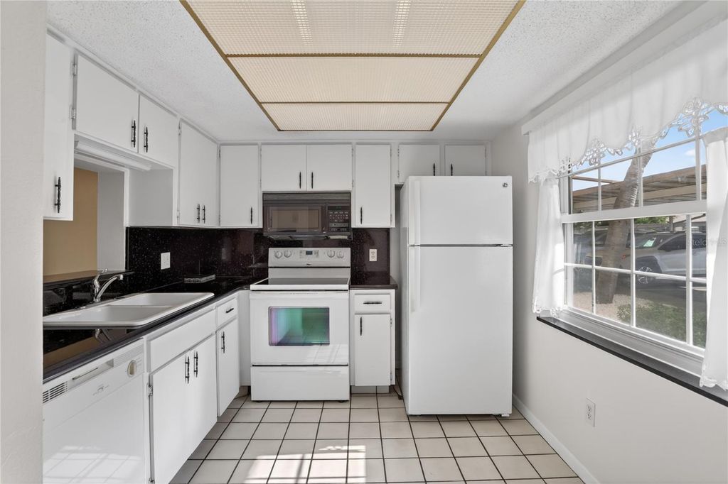 Photo of 1370 Heather Ridge Boulevard #102, Dunedin, FL 34698 (MLS # W7885555)