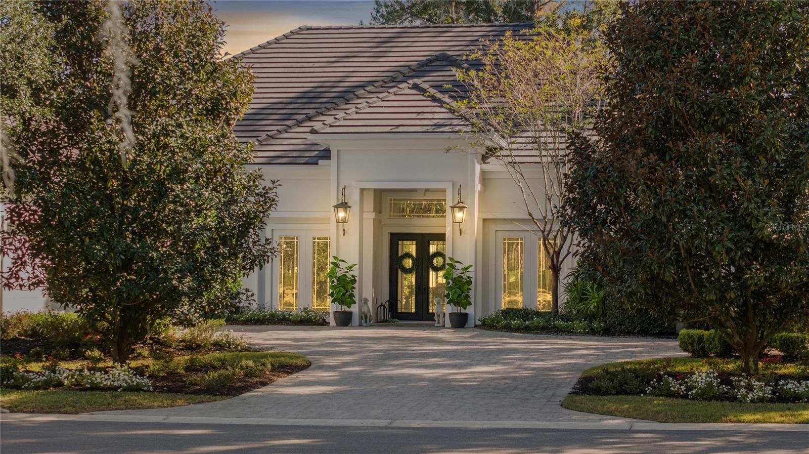One or more photo(s) has been virtually staged. The Golden Ocala home of your dreams sits perched over the famous tribute golf hole from Augusta National, the "Amen Corner". If spectacular views are important to you, this home is a must see. Beautifully constructed by Luetgert Development, this home features over 4,100 square feet of modern living. Boasting tall ceilings and open concept living with numerous windows and patio doors to showcase natural light and a grand outdoor living space, which inevitably shows off the picturesque views. A stunning paver patio surrounds the pool and spa featuring a complete summer kitchen with a bar to entertain and enjoy the view. For the equestrian, this home is very near and accessible by golf cart to the Golden Ocala private barns as well as all the other amenities. The spacious garage has extra tall ceilings which could easily house car lifts to add to the two car+ golf cart, if needed. Beautifully landscaped, this home offers lovely seclusion. Live golden in this beautiful home and enjoy all of Golden Ocala's spectacular amenities, and just a short golf cart ride away from the World Equestrian Center.