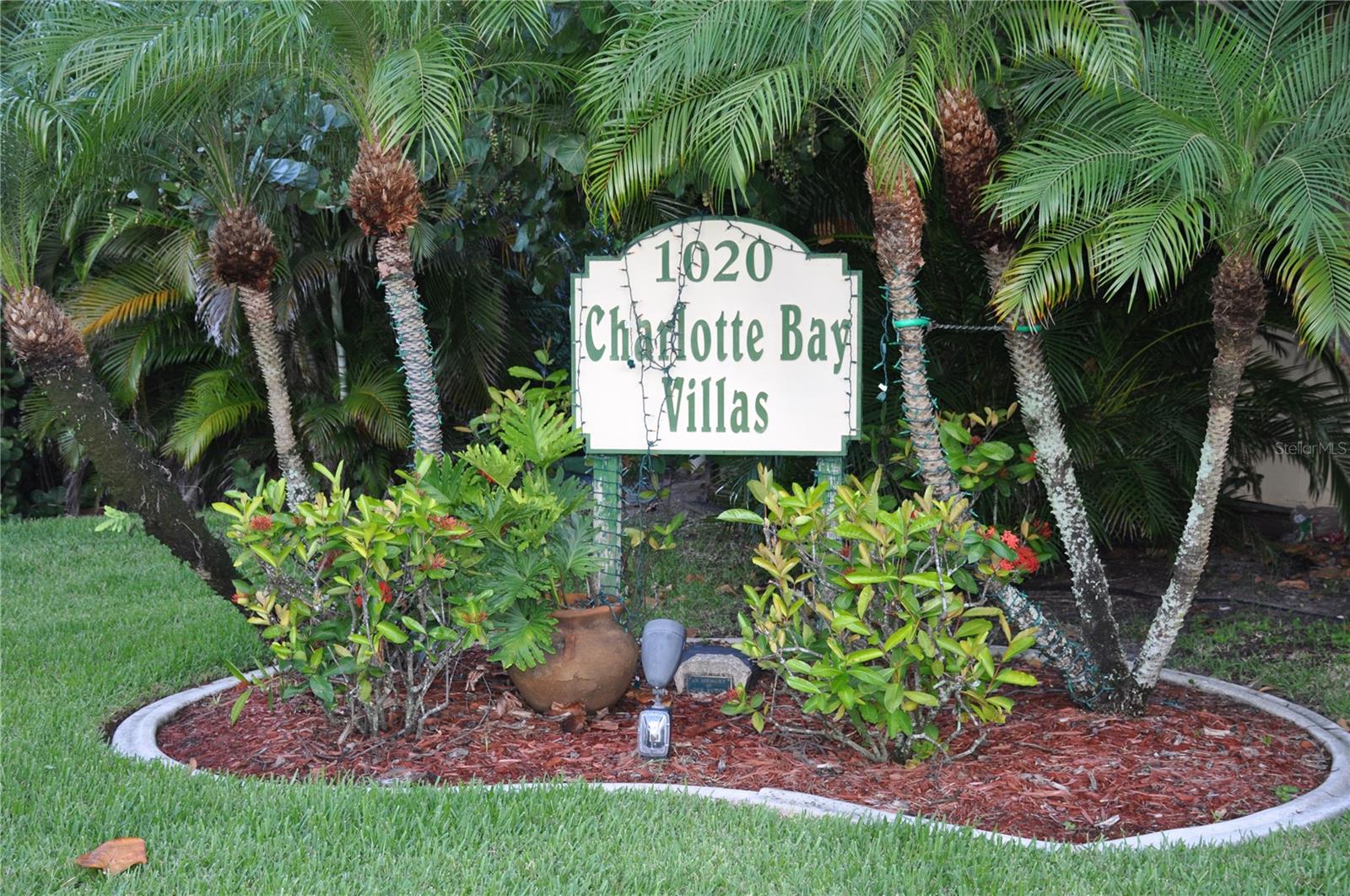 Within close proximity to Fishermen's Village and the Historic Downtown Punta Gorda, is Charlotte Bay Villas. This charming 2 bedroom, 2 1/2 bath townhome condo has just been newly installed luxury vinyl plank in the living areas and carpeting in the bedrooms and hallways. The kitchen features a brand new stove, dishwasher, refrigerator, and solid surface counter tops, along with a new water heater, new sink, and hurricane sliding doors that lead to the lanai from your living/dining room combo.