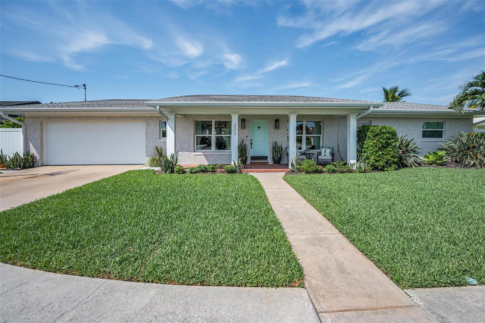 Welcome to 223 Howard Drive in the highly desirable Belleair Beach. This quiet waterfront neighborhood provides privacy, exclusivity, and is just minutes to white sandy beaches, shopping, and dining. Truly a rare opportunity to own a fully rebuilt, luxury home with modern upgrades and exquisite finishes. This 3 Bedroom, 4 Bath, 2 Car Garage Home offers open concept living with amazing water views and direct bay access. Step outside to a backyard oasis featuring a brand new resort-like sparking pool (2023) with oversized sun shelves, a spa, 1,800 sq ft of turf (2025), 1700 sq ft of gorgeous travertine decking, a custom fire pit, an outdoor shower, and a 100ft of new TruLine seawall (2023). This dream-like backyard has 9 ft water depths at seawall, sweeping views, and is perfect for either entertaining or relaxing in your own private retreat. Inside you will find a Chef's Kitchen with a large granite island, Wolf dual-fuel gas range, Miele Dishwasher, Dacor Refrigerator/Freezer, a Wine Fridge, Bar, and custom cabinetry. Every aspect of this 2,473 sq ft home has been meticulously and thoughtfully upgraded over the years including the framing, wiring, plumbing, insulation, impact windows, and even the tabby shell stucco creating the perfect coastal-vibe for waterfront living. A few more recent highlights include new Roof (2025) new sod in front yard (2025), HVAC (2022). Be prepared to fall in love with this stunning residence. Schedule your private showing today!