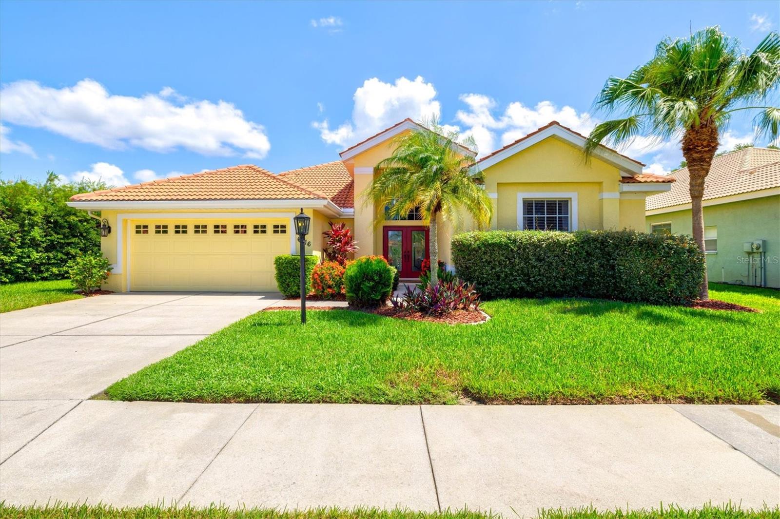 Gorgeously updated 3 bedroom 3 bathroom pool home with long lake views in the sought after Hamptons community of Palmer Ranch. This is the largest active floor plan in the community with over 2600 sq ft under air and nearly 3500 under roof. This South facing home is light and bright and should check all of your boxes. A flexible floor plan allows for 3 or 4 bedrooms PLUS an office or den. High ceilings in the living spaces make the house feel open and airy with views of the pool and lake from the tastefully updated dining and living rooms. The master suite is generously sized and offers direct pool access, lake views, a large en suite bathroom with his and her sinks and an oversized walk-in closet. Two of the other three bedrooms are large enough to accommodate King size beds, one of which has it's own en suite bathroom. The smaller 4th bedroom potentially works better as a nursery, office, or workout room. The eat-in chef's kitchen has been newly remodeled with white shaker cabinets and matte black hardware, picket style backsplash and black granite counters that are perfectly on trend. A separate laundry room off the kitchen features a brand new washer and dryer and a handy utility sink. The oversized garage is large enough for two cars plus bikes and storage. Step outside to the screen enclosed lanai offering outside dining under covered roof and an in-ground pool and spa with fountain feature. Other recent upgrades include New dishwasher (July 2025), New AC (December of 2023) and New hot water heater (November of 2023). The lot location is unique, sitting at the Southern tip of a wildlife rich community pond allowing for both views and privacy. The Hamptons is conveniently situated just 2 minutes from the Legacy Bike Trail, 10 minutes from the South entrance of Siesta Key, only 15 minutes to Lakewood Ranch and a short 20 minute drive to downtown Sarasota. With A-rated schools and established residential communities and shopping plazas all around, this a can't miss for quality of life and long term investment. Don't miss your chance to get everything you want at a price that cannot be beat! Schedule your private showing today.