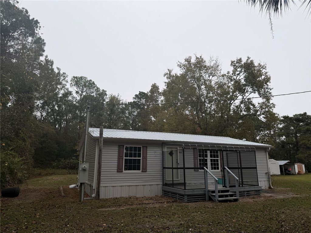 Photo of 212 Paradise Shores Road, Crescent City, FL 32112 (MLS # GC536022)