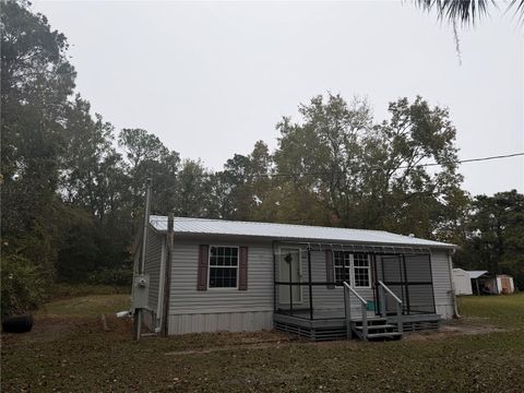 Photo of 212 Paradise Shores Road, Crescent City, FL 32112 (MLS # GC536022)