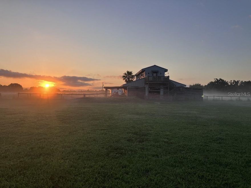 Peace and Tranquility. At the end of a long shared gated drive sits this gorgeous 5 acre parcel of premium Myakka paradise. Just a property away from TerraNova Estates where homes are soaring higher than 9 million and in close proximity to the equestrian center, the exclusive Miakka Golf and the Myakka River State park sits a perfect location on a premium road. 

The property has a new well 2025, 200 amp power on the property including a 50 amp RV hookup, and a new septic 2026, all three permitted. There is also a 48 x 50 center aisle barn on concrete building pad, fully rubber matted with an enclosed climate controlled feed/tack/storage room currently set up as a laundry room.

Bordered on one side by 700+/-feet of creek flowing to the Myakka River with ancient oaks  this land is perfect for your country vision. The grass is deep here thanks to the creek bottom soil. The fenced and cross fenced pastures give immediate grazing opportunities and an outdoor shelter on the north and south sides of the barn offers protection from the rains as well as the Florida sun. For the sportsman there is a shooting berm with custom metal targets and nighttime lighting as well as a deep stocked pond. 

Upstairs over the barn is a fabulous lounge including full bath drenched in sunlight from large windows and their panoramic views. With its 11 ft tall vaulted cedar board ceilings and exposed beams this space is perfect for entertaining after a day in the country. The loft was just recently refreshed and features a kitchen with brand new stainless steel fridge, brand new 30 inch cooktop with power boil function. Maldives blue wood cabinets, stainless steel Franke sink and sparkling quartz countertop. 

The lounge full bathroom boasts a corner shower with frosted glass door, a brand new chair height vortex toilet, zen vanity with sink and quartz countertop complete with a sliding door for privacy. The watercolor solid wood tongue and groove walls, solid stranded bamboo floors, matte-black hardware and amber glass lights throughout set the tone for ultimate relaxation. There are 3 brand new ac units in the lounge and two of them have heat for those chilly winter evening get togethers. And if that isn’t enough then don’t miss the 3 huge barnwood corner armoires offering ample storage for your hiking wardrobe, fishing lures and tackle, riding clothes and more!

This property has unlimited potential and the barn and lounge will satisfy any hobbyist, collector, equestrian or equipment needs for the entrepreneur and small business owner, but that is just the beginning. The sunsets from this property are absolutely mind blowing and the elevation of the deck off the lounge allows you to see a sunset not many in Myakka get to experience. It’s the perfect way to end everyday in the country. 

So wether you are a partial year resident looking to warm up and relax, a hobbyist looking for more space for your passions, an entrepreneur looking to increase the quality of your life, an equestrian that has always wanted a place of your own or even someone with the vision to create their own barndominium this property checks all the boxes.