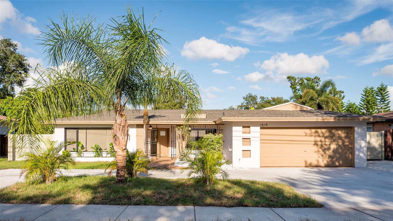 Welcome to this stunning, fully renovated Home with a Pool in the desirable Clearwater. Every inch of this residence has been meticulously redesigned, featuring a brand-new roof and HVAC system for your peace of mind. Step inside and discover a home packed with high-end finishes, including new Luxury Vinyl flooring, interior doors, and fresh paint inside and out. The heart of the home is the brand-new kitchen, a true chef's dream with a large island, elegant shaker cabinets, gleaming quartz countertops, and sleek stainless-steel appliances. Right off the kitchen, a sliding door opens to the stunning screened-in pool area, creating a seamless flow from the inside out. The pool has been newly refinished and is surrounded by beautiful pavers, offering plenty of space for you to lounge and soak up the sun. With the outdoor grill and spacious kitchen island, this home is perfect for entertaining friends and family in true Florida style. The primary en-suite is a true retreat, offering a stunning bathroom and a walk-in closet. The primary bath features an incredible walk-in shower with captivating tile, while the second bathroom has equally amazing tile work around its inviting tub. And the best part? This incredible location puts you just 15 minutes away from stunning Clearwater Beach! Short-term rentals are allowed at this home, making it an incredible investment opportunity for those looking to capitalize on the vibrant tourist market. Imagine easy access to its world-famous white sands, an endless array of fantastic restaurants, and all the vibrant attractions that make Clearwater Beach a true gem. This isn't just a house; it's a meticulously crafted home, thoughtfully updated with every modern luxury and convenience you could wish for. It's truly ready for its next discerning owner to move in and start enjoying the best of Tampa Bay living.