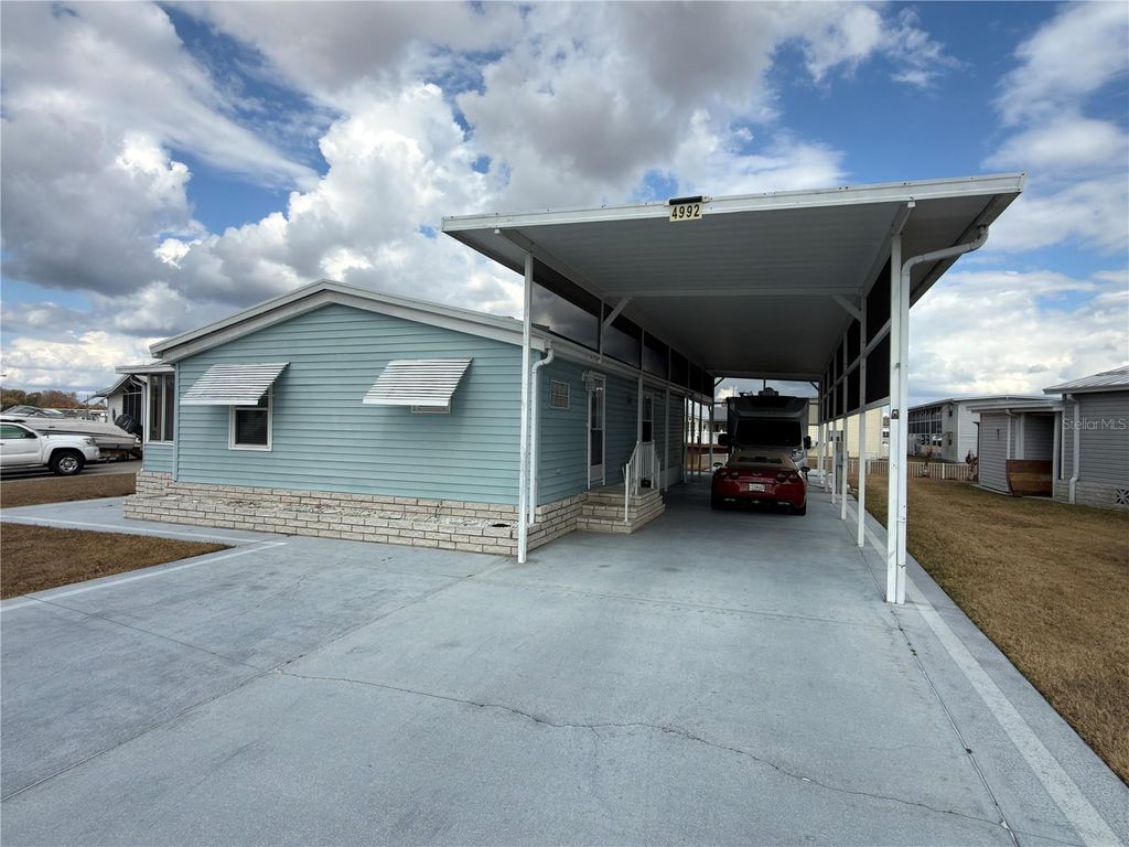 Photo of 4992 Shore Line Drive, Polk City, FL 33868 (MLS # P4937749)