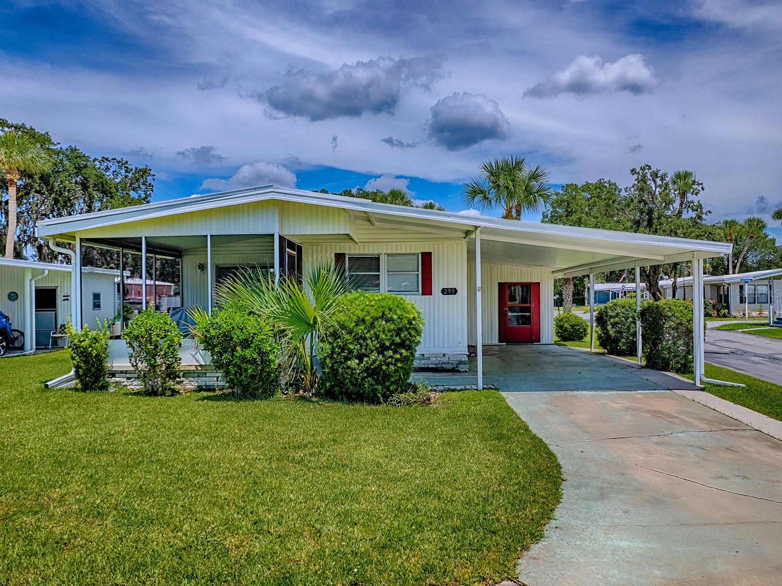 Well maintained 2 bedroom, 2 bath home in the 55+ waterfront community of COUNTRY CLUB MANOR. Fully furnished and move in ready! Fresh interior paint, new hot water heater 2024, A/C 2020. Lovely screened lanai to enjoy Florida's fall and winter months. Monthly co-op fee of $231 includes water, sewer and trash pick up. Community boat ramp, heated lakefront POOL and fishing pier. Only minutes to downtown Eustis with great restaurants and shopping. Perfect winter retreat - come and see today!