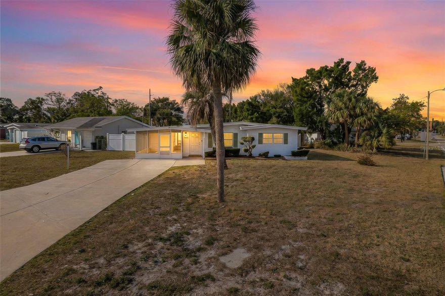 This clean and convenient corner-lot home offers 2 bedrooms, 1 bathroom, a bonus room, and a well-appointed kitchen with a full set of stainless-steel Samsung appliances. The fully fenced backyard, enclosed with vinyl privacy fencing, includes an oversized shed. The laundry room sits in the fully screened side lanai, complete with pull-down blinds that allow you to see out while keeping prying eyes away. A double driveway adds to the home’s many conveniences. Located just far enough from US19 to stay peaceful, it’s still close to shopping, restaurants, parks, beaches, and medical centers. With professional lawn care included by the landlord, you get the best of both worlds—enjoying the privacy of a single-family home without the hassle of the yard work that typically comes with it!