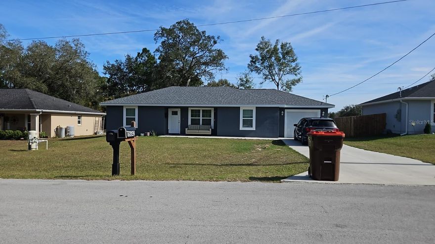 Welcome to this brand new 3-bedroom, 2-bathroom single-family home located in the peaceful Summerfield area. Built in 2024, this home offers a modern split-bedroom floor plan with approximately 1,232 square feet of living space, high ceilings, and durable porcelain tile flooring throughout. The open concept kitchen is equipped with stainless steel appliances, ample cabinetry, and overlooks the main living area, making it ideal for everyday living and entertaining. The primary suite features a walk-in closet and private bathroom, while two additional bedrooms provide flexibility for guests, family, or a home office.

Enjoy the convenience of an inside laundry room, central heating and air, ceiling fans, and an attached one-car garage with an automatic opener. Situated on a spacious, cleared lot with sod, this home offers outdoor space with a private wooded backdrop. No HOA provides added freedom, and the location offers easy access to shopping, dining, healthcare, The Villages, and Ocala. This move-in-ready rental combines comfort, modern finishes, and a quiet setting. Schedule your showing today.