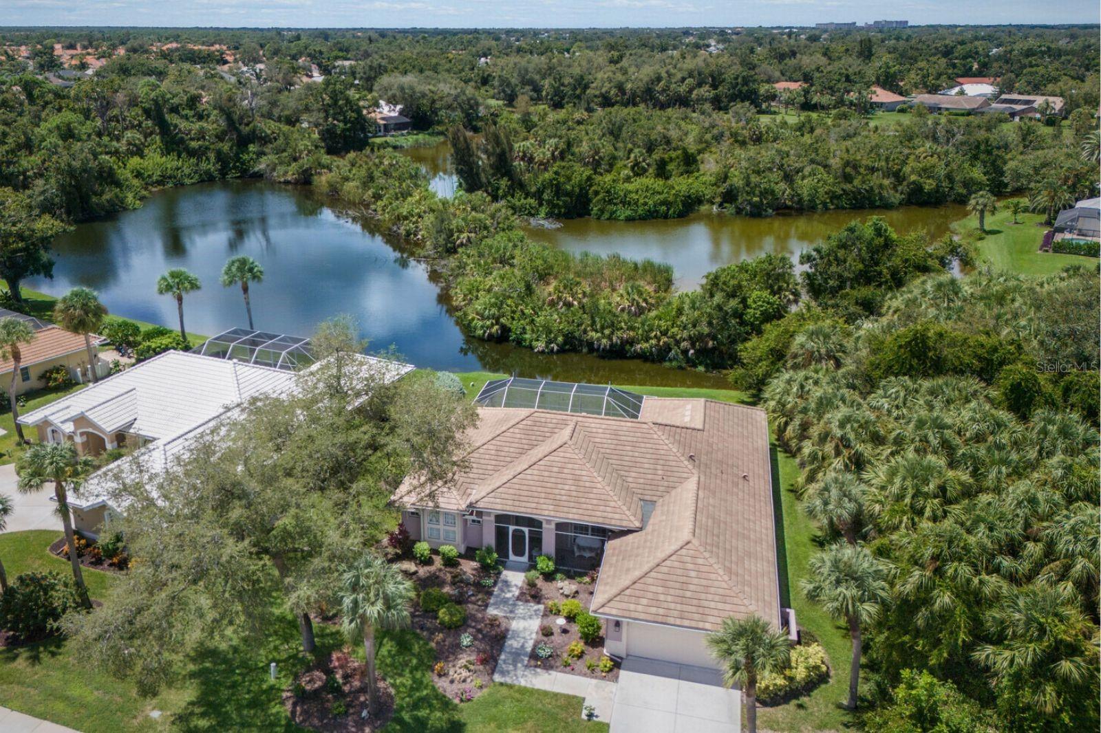 Discover why The Lakes of Jacaranda is one of Venice’s most desirable communities—and why this home is your perfect chance to be part of it. a spacious pool home with serene water views and the upgrades you’ve been waiting for.
Wake up to serene lake views and spend your afternoons poolside in the privacy of your own tropical retreat. The screened lanai is a true source of bliss , offering a sparkling resurfaced pool with updated systems, plenty of space for lounging or entertaining, and a backdrop of tranquil water and lush landscaping. From sunrise coffee to evening gatherings, this outdoor oasis is where you’ll want to be.
Step inside and the sense of openness continues. Walls of sliders flood the living spaces with natural light, seamlessly connecting indoors to out. The formal living and dining rooms impress with soaring 12-foot ceilings and crown molding, while the oversized family room with tray ceiling is perfect for casual nights in or hosting a crowd. The updated kitchen is both stylish and functional, featuring granite countertops, stainless steel appliances, a walk-in pantry, and a sunny eat-in nook overlooking the pool.
The primary suite is a peaceful escape, complete with tray ceilings, dual closets, and a spa-inspired bath with soaking tub, walk-in shower, and dual vanities. Two additional bedrooms, each large enough for a king bed, provide comfort and flexibility for family and guests.
Thoughtful updates throughout the home provide peace of mind, including a new roof, hurricane-rated sliders, storm shutters, resurfaced pool, new electrical panel, and fresh paint inside and out.
Beyond your door, The Lakes of Jacaranda offers a community pool, clubhouse, tennis and pickleball courts, scenic walking and biking trails, and plenty of planned activities to enjoy with neighbors.
All this just minutes from Gulf beaches, charming Venice Island, shopping, dining, golf, medical facilities, and even spring training baseball.
This is more than a home—it’s your entry into one of Venice’s most beloved communities. Rarely do opportunities like this come available.