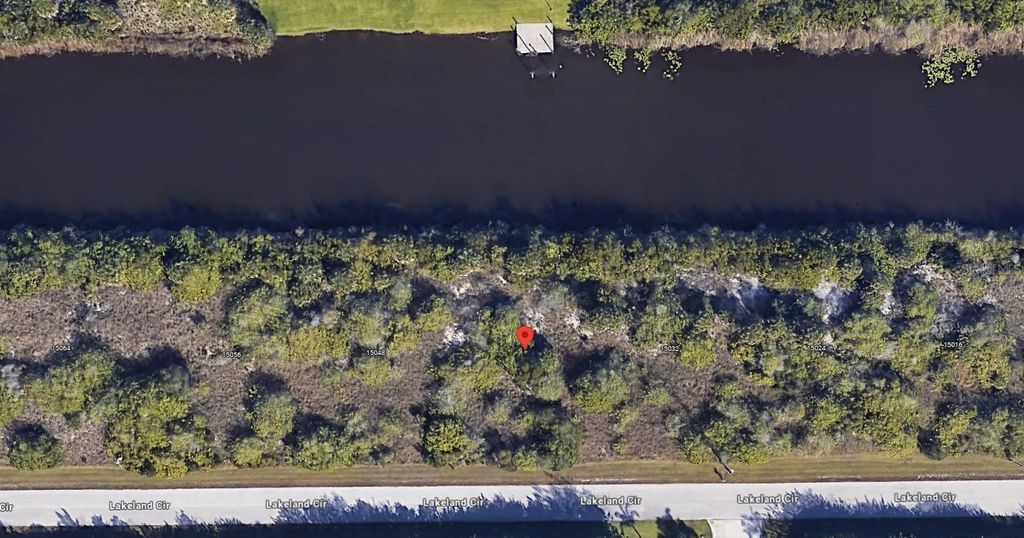 Photo of 15040 Lakeland Circle, Port Charlotte, FL 33981 (MLS # O6345136)
