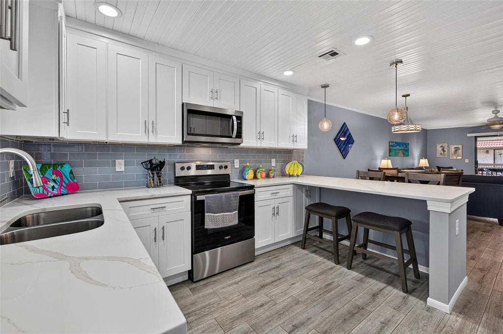 Photo of 1634 Stickney Point Road #34-202, Sarasota, FL 34231 (MLS # C7531777)
