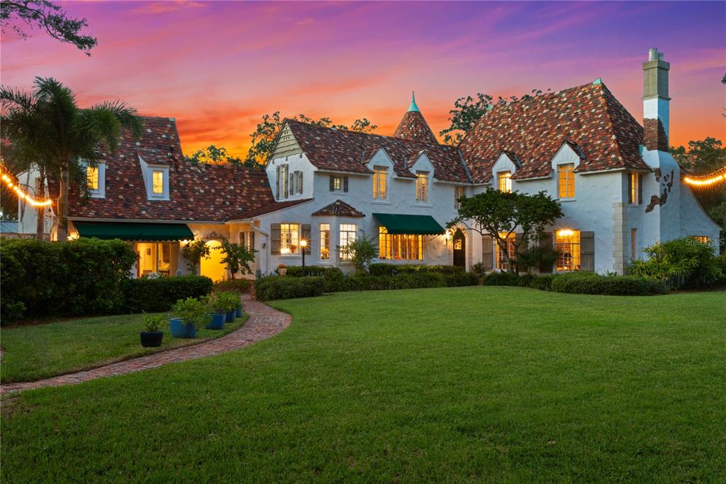 Do not miss out on this rare Land opportunity on a deep-water canal on highly sought after Ladoga Ave on Davis Island. This enormous lot creates an opportunity to have 165 feet on a deep-water sailboat-friendly canal and is over a half-acre! This European style home has enough storybook charm to transport you back to 18th century Europe. The home features 5 bedrooms and 4 bathrooms and is 4,242 square feet, including a newly renovated, attached 1/1 guest house, perfect for extended family stays. The eye-catching steeply pitched gable clay tile roof and the brick and stone chimney create a unique warm and inviting curb appeal to the home. While the home is captivating, the price for this property reflects a land sale. You’re getting the house for free! Do not miss out on this unique opportunity to be on regal Ladoga Ave on this Davis Island Estate property and be the king of the castle or build your own castle. The home is not historically registered, so you’re free to renovate or build new on your new property. Seller has a variety of renovation, addition and new construction site plans and floor plans for serious Buyers. Please inquire for more details on recent upgrades and potential plans. This captivating home is only minutes from downtown and all of Tampa’s cultural activities, top-rated schools, churches, businesses, and sporting events. Enjoy all the Davis Islands amenities, including a golf cart designated community, community pool and tennis facility, marina, boat ramp, dog park/beach, playground, beach, Bayshore Little League baseball fields and the Davis Island Yacht Club.