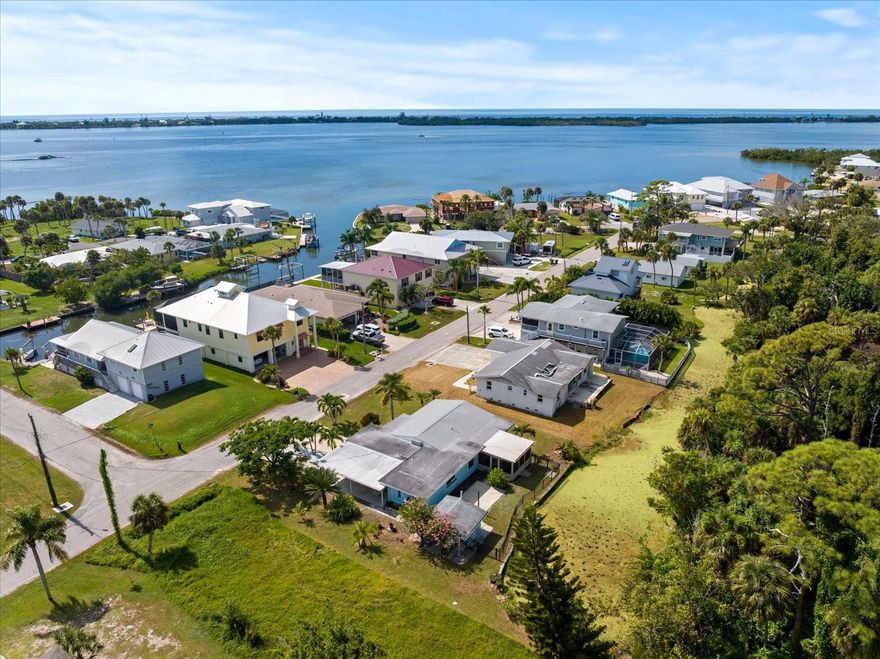 Welcome to your slice of paradise in Englewood — a fully renovated coastal retreat where modern comfort meets the laid-back Florida lifestyle. Just minutes from Englewood Beach and historic Dearborn Street, this move-in-ready home sits on an oversized lot in a friendly, charming neighborhood filled with colorful coastal homes and a peaceful, welcoming atmosphere.
Step inside and feel the fresh, airy flow of new tile flooring throughout, connecting bright open living spaces designed to reflect the sun and sea. The modern kitchen shines with brand-new cabinetry, sleek stainless-steel appliances, and elegant fixtures that blend perfectly with the home’s beachy, modern aesthetic. Updated bathrooms feature stylish finishes and soft, coastal tones that evoke the serenity of the nearby Gulf.
A light-filled Florida sunroom overlooks a beautiful canal in the backyard, providing privacy and a sense of separation — no neighbors directly behind you, just tranquil water views and gentle breezes. The attached garage and covered carport provide plenty of space for vehicles, boats, or golf carts, with a storage shed for all your outdoor essentials. The lush, tropical landscaping completes the picture, creating a serene outdoor oasis perfect for entertaining or unwinding after a day at the beach.
Behind the beauty, this home provides total peace of mind with brand-new plumbing and electrical systems, energy-efficient upgrades, and most windows upgraded to hurricane impact-rated glass. All appliances include a 1-year manufacturer’s warranty upon registration!  With its ideal location, modern updates, and tranquil canal setting, this home is more than move-in ready — it’s a lifestyle. Whether you’re a snowbird escaping the cold or a full-time resident ready to live the Gulf Coast dream, this Englewood gem is your perfect beach retreat.
