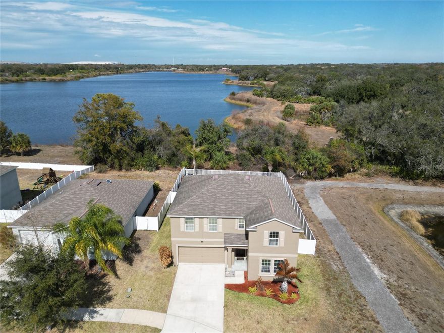 Welcome to your dream home in the gated community of The Preserve at Bullfrog Creek. Offering 3,362 square feet of living space with 6 bedrooms, this beautifully maintained 2018-built home delivers privacy, space, and modern upgrades—with no rear or right-side neighbors. The open-concept floor plan features the primary suite and additional bedrooms on the first floor, making it ideal for flexible living. The bright main level showcases tile flooring throughout the living areas, expansive living and dining spaces, and a modern kitchen equipped with stainless steel appliances, a center island with breakfast bar, a large walk-in pantry, and abundant cabinetry. The primary suite offers serene views of the rear conservation area and includes a custom walk-in closet system. The spa-like primary bath features dual separate vanities, upgraded adjustable lighting, a custom multi-water shower, and a soaking tub. Upstairs, you’ll find four additional bedrooms, including one with a walk-in closet, along with a spacious loft currently used as a media area, offering beautiful window views and a perfect retreat. A first-floor laundry room adds everyday convenience. Situated on a 7,900+ sq ft lot, the outdoor space is designed for privacy and relaxation with vinyl fencing, a paver patio, and a hot tub—ideal for entertaining or unwinding. Enjoy low HOA fees and a prime location near Vance Vogel Park, top-rated schools, the YMCA, shopping, and dining. With quick access to I-75, you’re just minutes from downtown Tampa, Ybor City, and Florida’s world-famous beaches.