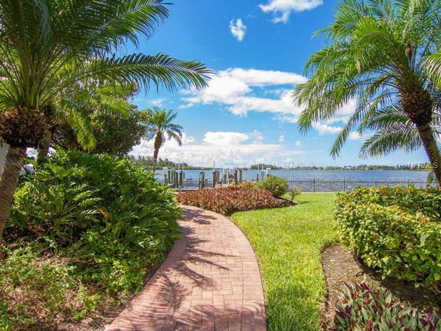 With uncompromising southern Bay views, this California mission style manse is situated on approximately 1.5 acres on one of Sarasota's favorite streets. Ultimate convenience to the mainland, this walled and gated North Siesta Key estate has lush tropical gardens providing privacy for the owner. Surrounded by the beautiful Bay waters and a side canal totaling over 403' of seawall with 2 deep water boat docks and an old fashioned boat house for small craft. Comprised of over 9,385 sq. ft of air conditioned space, the 6,837 sq. ft. Main house and 2,548 sq. ft. Guest house are connected by an interior hallway lending tremendous flexibility for a large family, multiple guests or extensive office facilities. Major renovations were performed over the years. Features include high ceilings, marble floors, light oak sold wood doors, trim and tongue-n-groove ceilings, walls of glass for endless water views, spacious rooms, a new barrel tile roof, a long approach with a circular driveway, a phenomenal private heated tropical pool and spa retreat, and a gazebo for relaxing and entertaining. 3 car garage with hurricane rated doors and additional rear garage door leading to oversized parking pad. Seize this opportunity to claim a rarified amount of land and home with arguably some of the area's best deep water boating and tremendous Bay views. This property includes parcel #2019-15-0028 bayfront lot. Lot dimensions are of non-submerged land. Square footage is both lots.