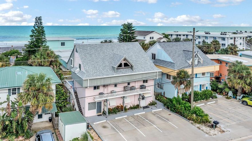 Uncover the ultimate investment gem – a remarkable TRIPLEX nestled just a heartbeat away from the beach! Embrace the coastal dream with two exquisite 2-bed, 2-bath apartments, complemented by a spacious 2-bed, 1.5-bath unit; a perfect blend of comfort and convenience. Revel in seamless beach access without crossing busy streets, while relishing a peek-a-boo ocean view, an outdoor shower, and newly upgraded "maintenance-free wood" stairs leading to the balconies. Feel secure with hurricane-grade windows, and delight in being minutes away from Flagler Ave's shopping and entertainment. This rare SHORT-TERM RENTAL zone promises an exceptional INVESTMENT opportunity – own your slice of paradise today! ;Water: City