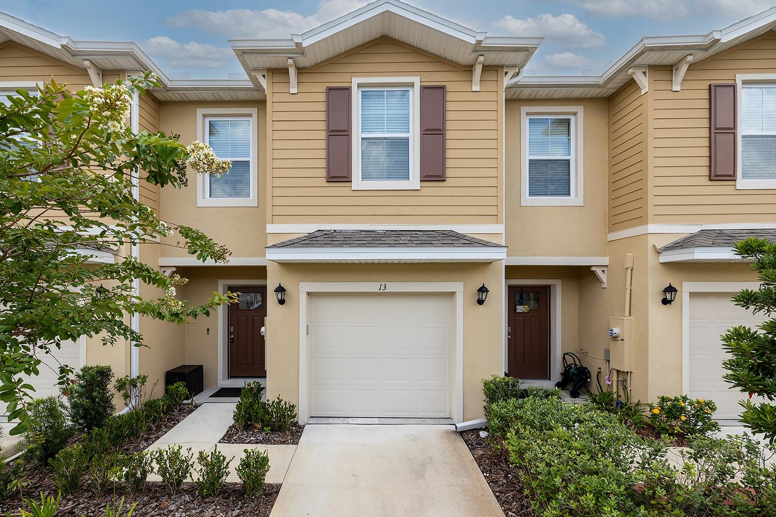 Better than Brand New! Welcome Home to your meticulously maintained 3 bedroom, 2 1/2 bathroom townhome in the heart of Port Orange, nestled in the highly sought-after Bella Oaks Community! Upon entering, you'll notice the tile flooring flows seamlessly throughout the main living area. This spacious & stylish home features a gorgeous kitchen with elegant backsplash, an abundance of cabinetry and beautiful countertops. Very nice dining area flows into the large living room, perfect for entertaining! Moving to the upstairs, the stair case has been refinished with beautiful hard wood flooring, truly making this home stand out. The luxury vinyl plank flooring upstairs is consistent throughout! Large primary suite with walk in closet, featuring built in shelving, and private full bathroom! The guest bedrooms are roomy with adequate closet space, perfect for kids or a home office! The laundry area is upstairs, making the transition easy from the dryer to the dresser! The one car garage is equipped with an added storage rack and an abundance of room for an SUV and all your toys! Located close to shopping, dining, top rated schools, and just minutes from the beach! This move in ready home blends comfort, style, and practicality in one perfect package! Affordable HOA that permits a hands off lifestyle! Opportunities like this are rare. This home truly is in a league of its own... Call Today!