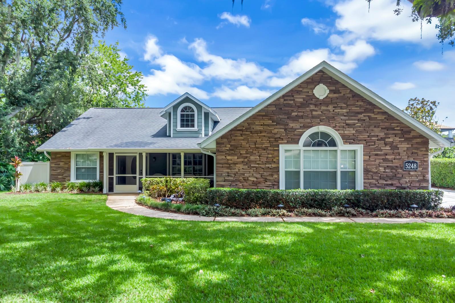 If you're looking for a beautiful, updated home in a peaceful yet convenient location with a truly spectacular backyard oasis, THIS IS THE ONE! You'll be captivated from the moment you pull into the wide, tree-lined streets of this inviting neighborhood; then you'll fall in love with the curb appeal of this charming brick-accented home, shaded by a majestic oak tree out front and greeted by the serene bubbling water feature in the lush landscaping as you walk up to the welcoming screened front porch. Step inside and the tranquil color palette and comfortably luxurious upgrades soothe the soul. The foyer opens to an expansive living room with soaring ceilings, upgraded 6-inch baseboards, and French doors leading to the pool. The updated and light-filled kitchen features crisp white cabinetry, classic subway tile, stunning granite countertops, stainless steel appliances, and a breakfast bar/pass-through to the living room. The adjoining breakfast nook is accented with pretty wainscotting and has its own French door to the lanai. The expansive primary suite easily accommodates large furniture and includes a pampering ensuite bath evoking French Country or Tuscan aesthetics where you'll find a generous walk-in closet, split vanities, built-in towel holders, a walk-in shower with shampoo niches and a jetted garden tub for a relaxing bath after a long day. The inside laundry room has a pegboard wall, convenient flip-up folding table, a laundry tub and the same granite and cabinetry from the kitchen across the hall for a cohesive and functional space. The secondary bedrooms are tucked away on the opposite side of the home, along with the updated second bath featuring a striking blue subway tile accent wall that opens to the pool. AND THEN THERE'S THE BACKYARD - AN ABSOLUTE SHOW STOPPER AND UNLIKE ANYTHING YOU'LL FIND IN THE AREA! This is the kind of space that makes a lasting impression—where casual get-togethers become memorable events. This isn’t your typical covered patio; it’s a full outdoor living space with high-end finishes that include a built-in grill, wine fridge, mini fridge, freezer, wet bar, actual kitchen cabinets and an extended bar with granite counter and brick accents perfect for gathering with friends. This level of outdoor design simply doesn’t exist in comparable homes—it's a standout feature that sets this property apart in a neighborhood already known for its upscale appeal. The sparkling sport-style pool featuring soothing modern waterfalls includes a sun shelf and volleyball net setup, plus ample lounging space, a spa, and an outdoor shower. The completely private bonus room is located next to the pool, making it perfect for a home office, gym, or man cave. Set on over a third of an acre fenced lot, the property also offers a storage shed, two-car garage, and oversized driveway. This home is part of a community with two low semi-annual HOA fees—one covers your water bill (as the HOA owns the water system), and the other preserves the high community standards that helps maintain the serene, enchanted-forest experience throughout the neighborhood. So, don’t miss your chance to own this private paradise—schedule your showing today! PLEASE NOTE: Audio and video recording may be in progress on this property for safety and security purposes. By entering, you consent to being recorded.