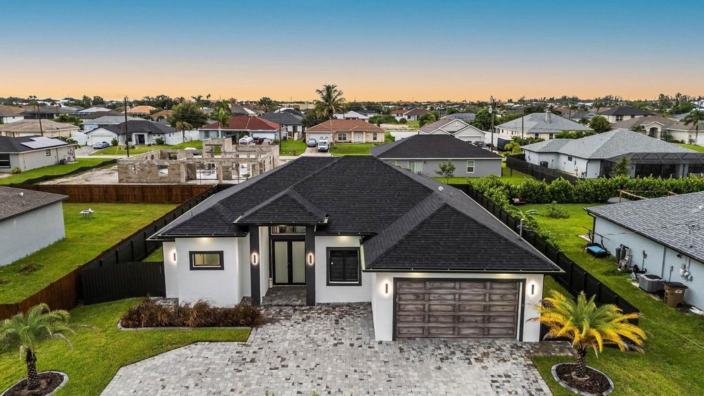Photo of 1112 Embers Parkway W, Cape Coral, FL 33993 (MLS # O6420797)