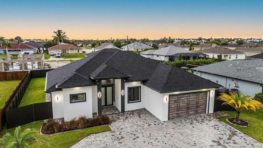 Photo of 1112 Embers Parkway W, Cape Coral, FL 33993 (MLS # O6420797)